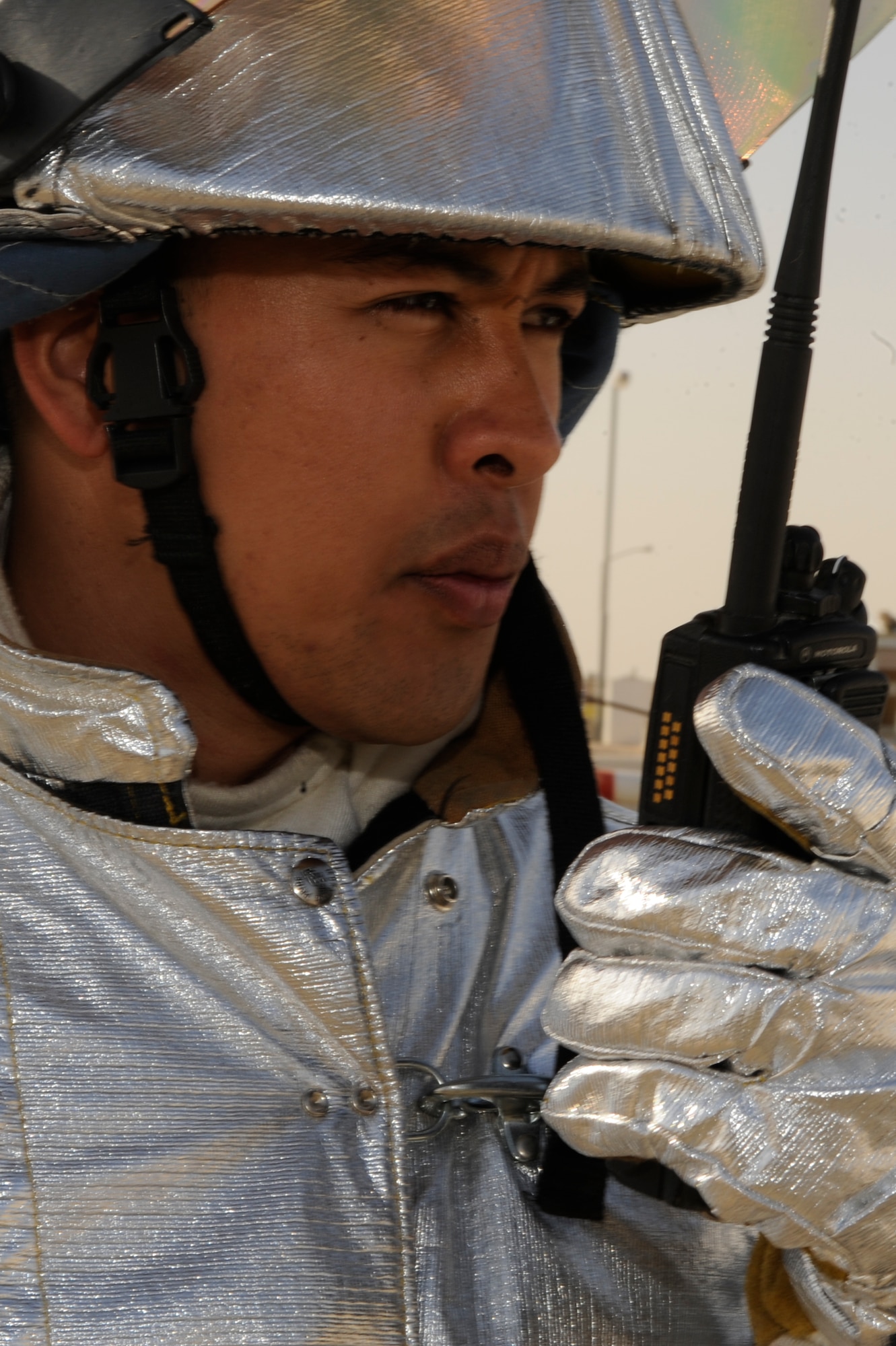 Tech. Sgt. Daniel Cruz, 332nd Expeditionary Civil Engineer Squadron firefighter, uses a land mobile radio to call in the status of a mass casualty scene during a an exercise at an undisclosed location in Southwest Asia, Jan. 30, 2012. Firefighters ensure the scene is safe from any fire hazards before allowing personnel into the scenario area. Cruz is deployed from Joint Base Pearl Harbor-Hickam, Hawaii, and is a native of Santa Rita, Guam. (U.S. Air Force photo by Staff Sgt. Joshua J. Garcia/Released)