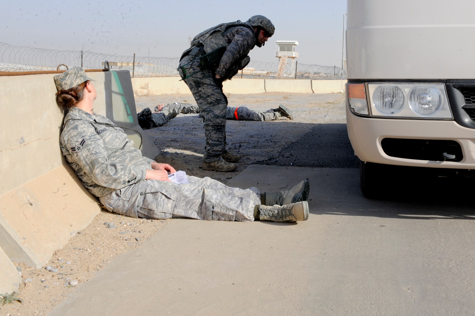 Staff Sgt. Matthew Aronhalt, 332nd Expeditionary Civil Engineer Squadron explosive ordnance disposal flight, performs an initial damage assessment during a mass casualty exercise at an undisclosed location in Southwest Asia, Jan. 30, 2012. As one of the first responders, Aronhalt cleared the area for any possible danger prior to letting other base personnel on site. Aronhalt is deployed from Nellis Air Force Base, Nev. (U.S Air Force photo by Staff Sgt. Joshua J. Garcia/Released)