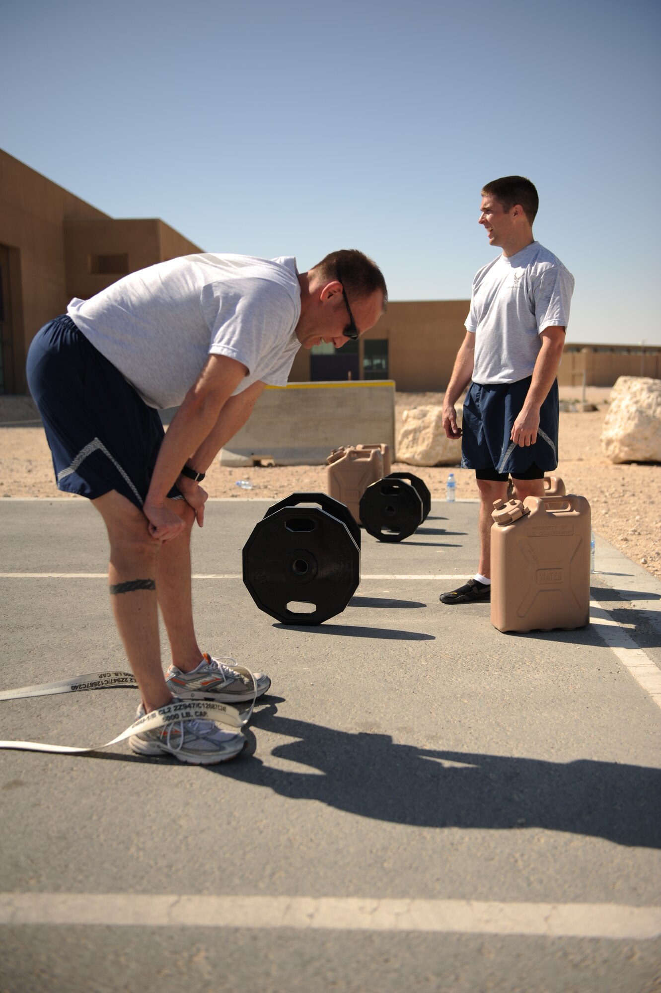 SOUTHWEST ASIA – Master Sgt. Joe Meyer, 609th Air and Space Operations Center and native of Richmond, Va., catches his breath after sprinting 400 meters here Jan. 27, 2012. Staff Sgt. Roberto Salinas created a new fitness program that incorporates many different aspects of fitness into one comprehensive workout. (U.S. Air Force photo/Staff Sgt. Nathanael Callon)