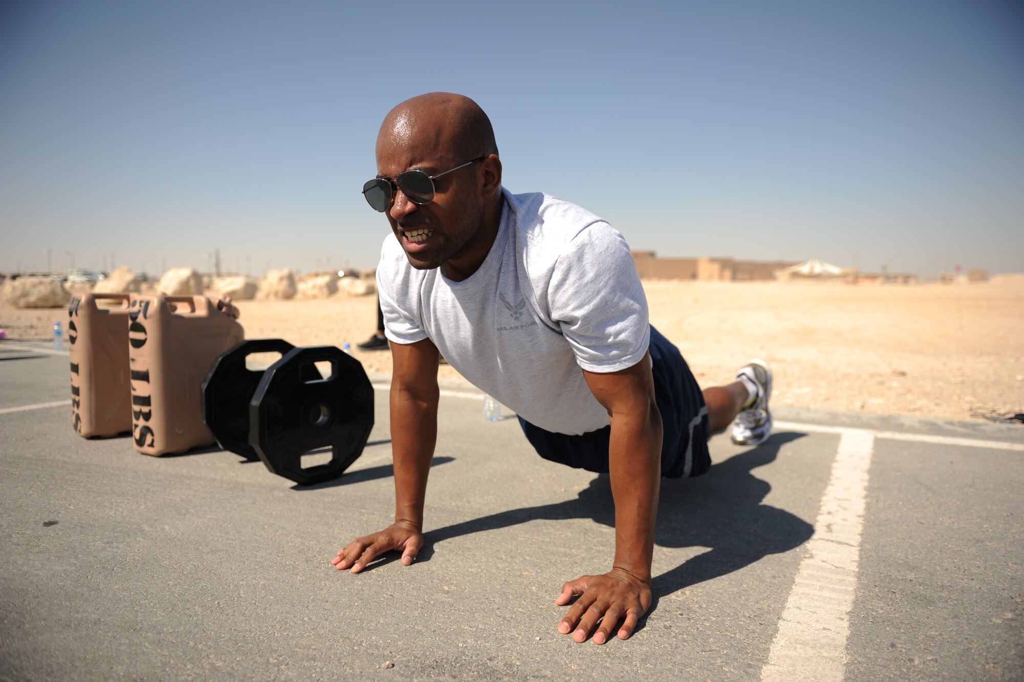 SOUTHWEST ASIA – First Lt. Kenny Thomas, 7th Expeditionary Air Command and Control Squadron and native of San Antonio, performs planks while working out here Jan. 27, 2012. Staff Sgt. Roberto Salinas created a new fitness program that incorporates gymnastics, power lifting and plyometrics to give service members a unique workout. (U.S. Air Force photo/Staff Sgt. Nathanael Callon)