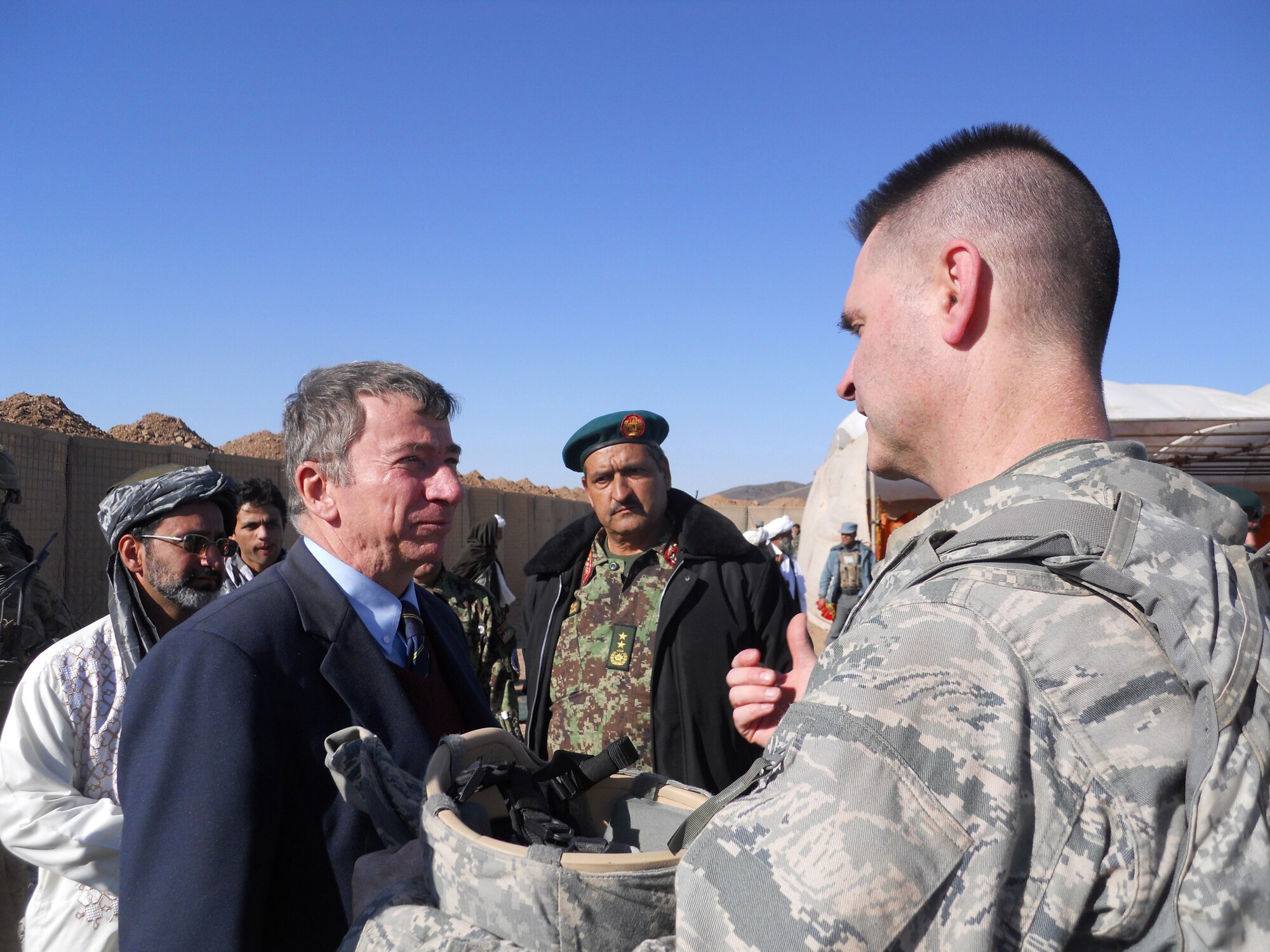 Mr. Brad Hanson,Afghan air force Maj.  Gen. Baqi and Air Force Col.  John Hokaj, commander of the 838th Air Expeditionary Air Advisory Group, discuss the hospital's impact to the local Shindand community Jan. 28, 2012.(courtesy photo)
