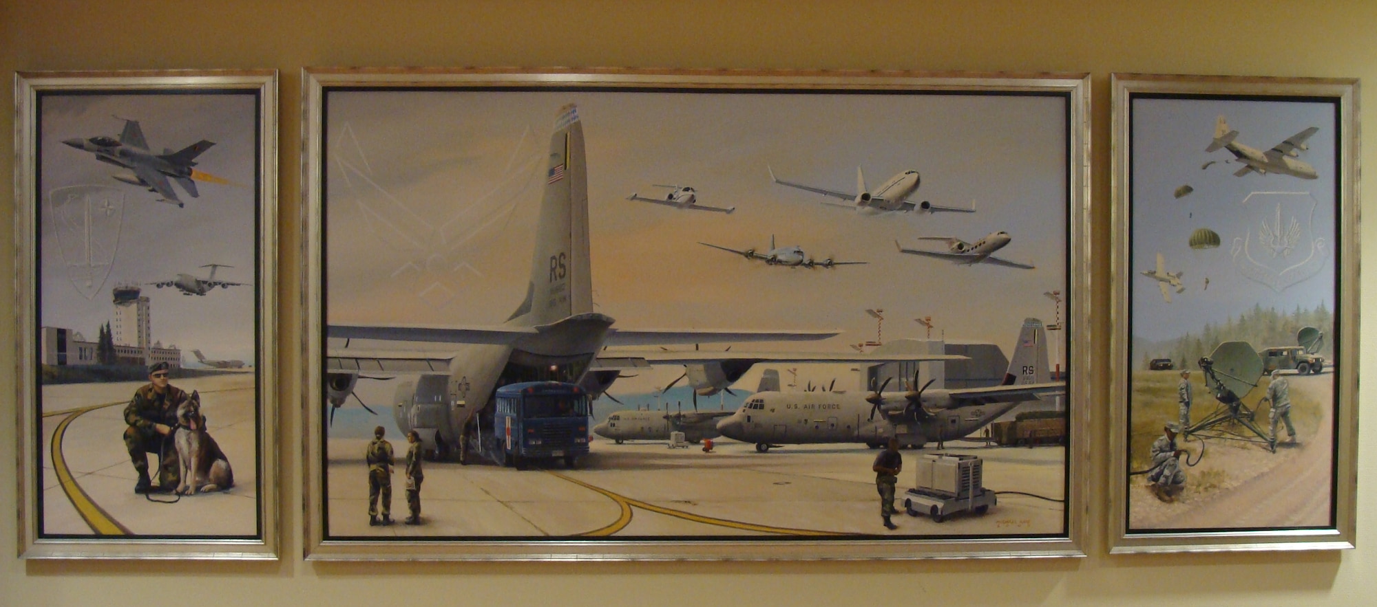 Air Force Art Program artist, Michael Kane’s painting is displayed in Heritage Hall located in the 86th Airlift Wing Headquarters building.  Kane stopped through Ramstein recently on the way to Afghanistan to document efforts of Airmen in Afghanistan.
U.S. Air Force photo by Maj. Elizabeth Aptekar 
