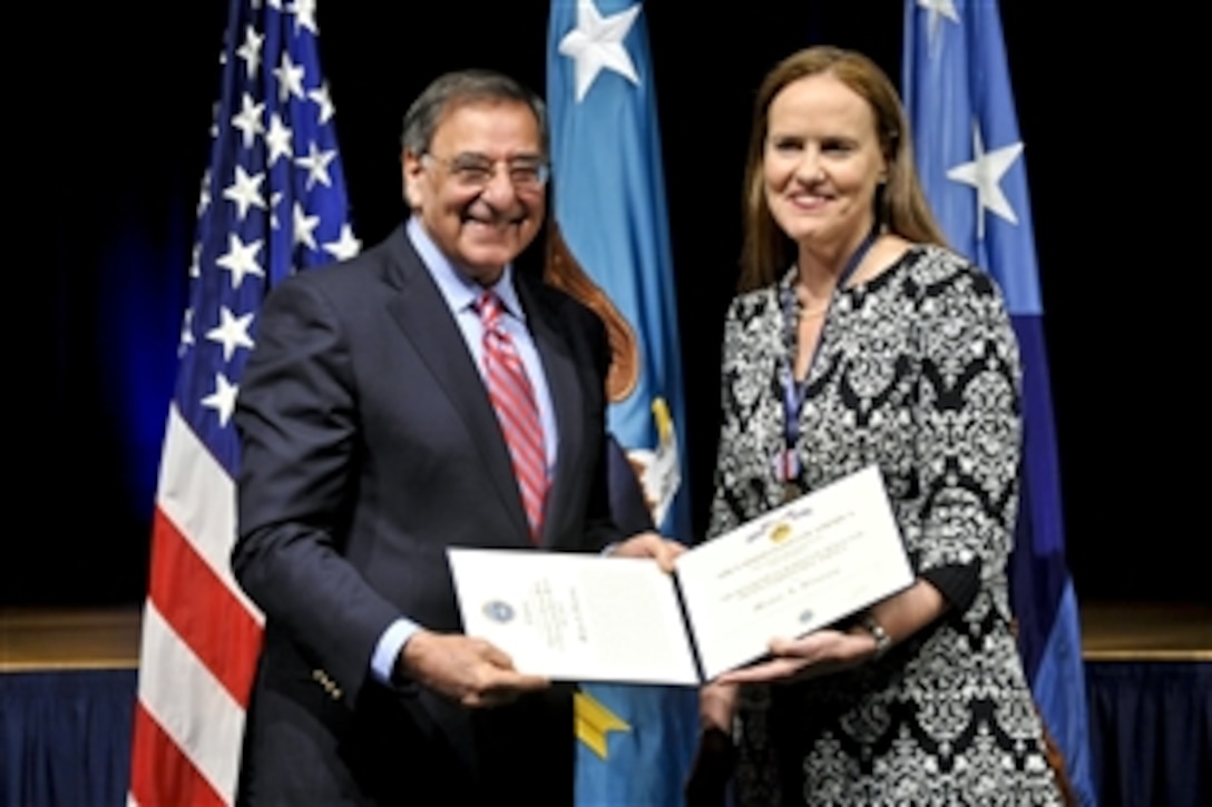 Defense Secretary Leon E. Panetta awards the Defense Department's Medal for Distinguished Public Service to Michele Flournoy, undersecretary of defense for policy, during a farewell ceremony in her honor at the Pentagon, Jan. 30, 2012.