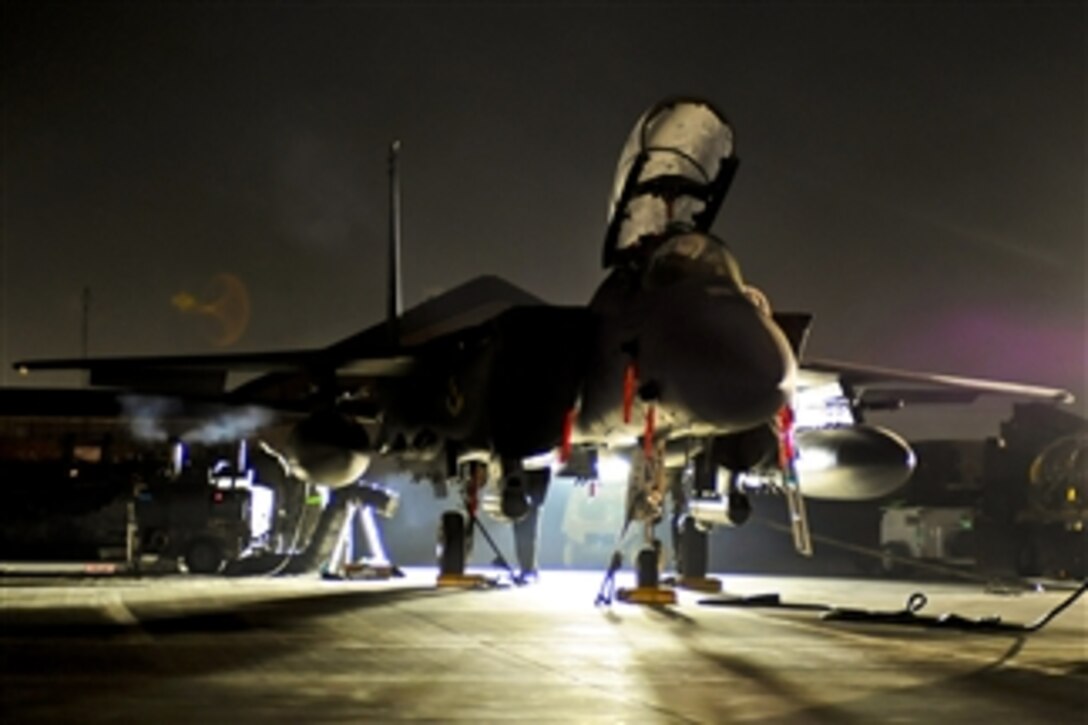 A U.S. Air Force F-15E Strike Eagle receives early morning maintenance at Bagram Airfield, Afghanistan, on Jan. 28, 2012.  The aircraft provides close air support to coalition forces.  The crew and aircraft are deployed from Seymour Johnson Air Force Base, S.C.  