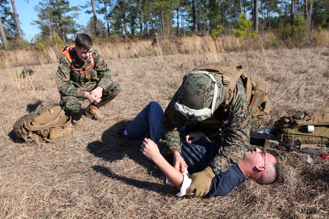 Petty Officer 2nd Class Kyle Culp, a hospital corpsman with Combat Logistics Battalion 24, 24th Marine Expeditionary Unit, provides aid to a simulated casualty during a mass casualty exercise at Oak Grove Outlying Airfield, Jan. 31. The 24th MEU deployed a Rapid Response Medical Team from the USS Gunston Hall off the coast of North Carolina during the exercise to provide emergency medical attention to around 30 simulated casualties. The 24th MEU is conducting their Certification Exercise (CERTEX) with Amphibious Squadron 8 scheduled Jan. 27 to Feb. 17, which includes a series of missions intended to evaluate and certify the unit for their upcoming deployment.