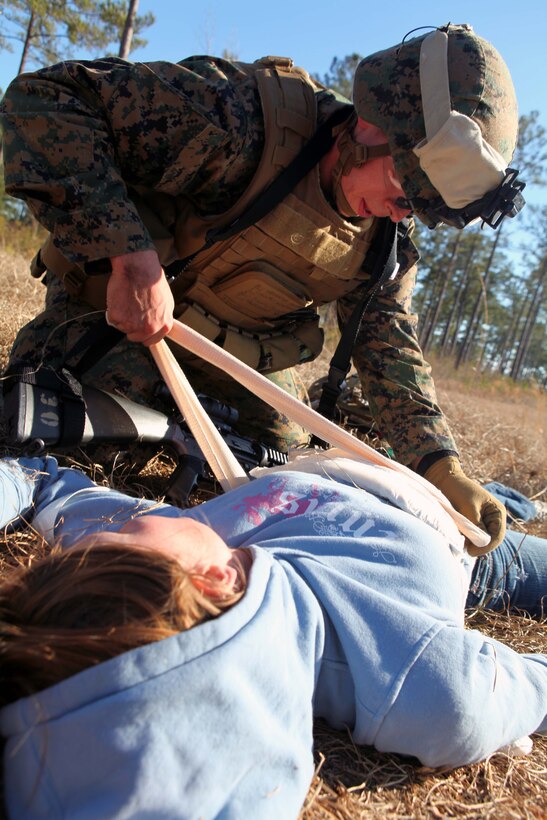 Seaman Philp Antony, a hospital corpsman with Charlie Company, Battalion Landing Team 1st Battalion, 2nd Marine Regiment, 24th Marine Expeditionary Unit, provides aid to a simulated casualty during a mass casualty training exercise at Oak Grove Outlying Airfield, Jan. 31. The 24th MEU deployed a Rapid Response Medical Team from the USS Gunston Hall off the coast of North Carolina during the exercise to provide emergency medical attention to around 30 simulated casualties. The 24th MEU is conducting their Certification Exercise (CERTEX) with Amphibious Squadron 8 scheduled Jan. 27 to Feb. 17, which includes a series of missions intended to evaluate and certify the unit for their upcoming deployment.