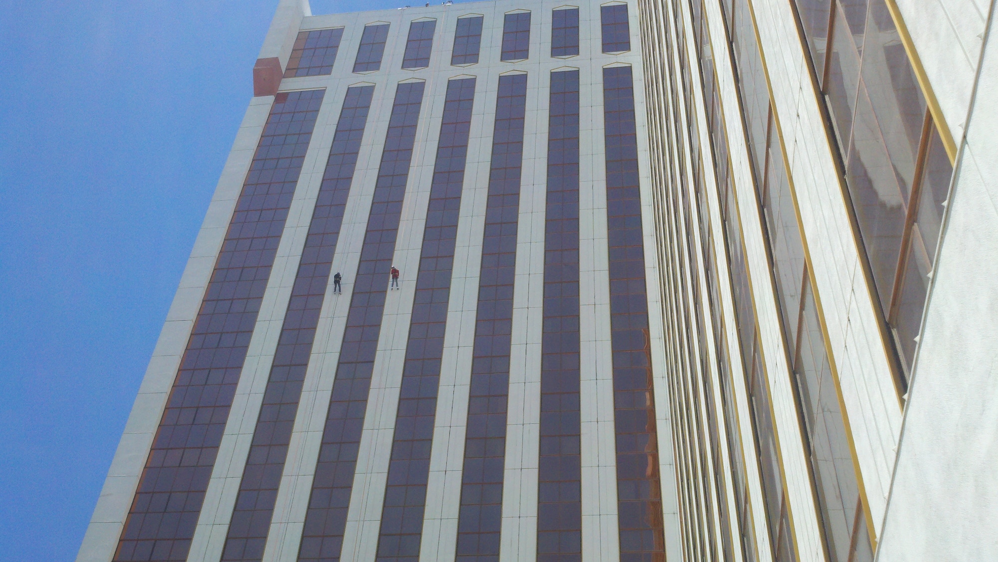 Master Sgt. Rick Hays (left, in black) and Col. Burkett (right, in red) rappelling down the 320 foot side of the Grand Sierra Resort in Reno, NV.  The rappelling was part of a fundraiser for the Special Olympics.