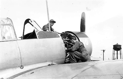 Private Ken Ganther, bottom, and a fellow mechanic work on a training aircraft at Randolph Field June 1941. (Courtesy photo)