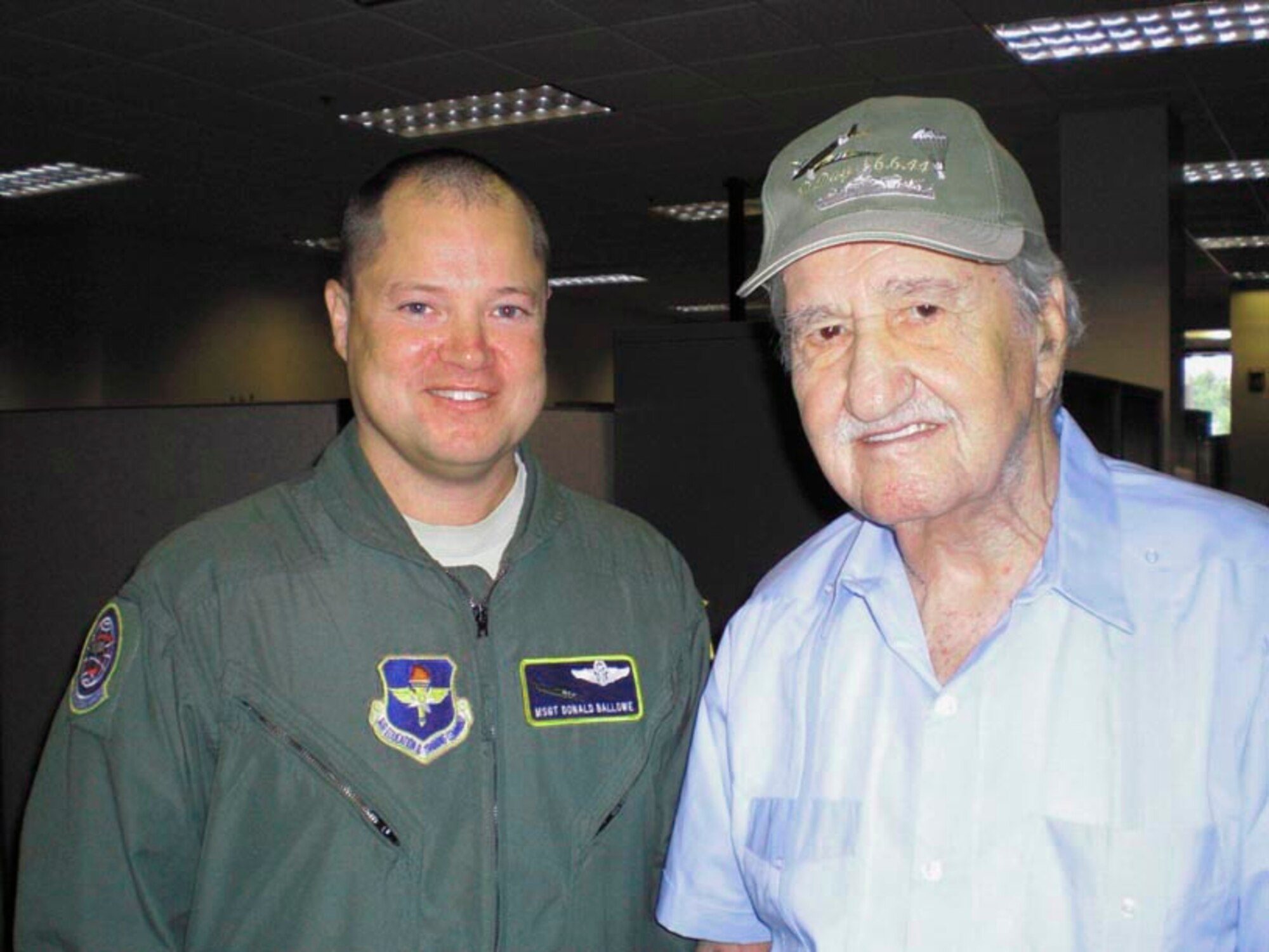 Master Sgt. Donald Ballowe, recipient of two Distinguished Flying Crosses with Valor for his actions in Afghanistan, and World War II veteran Ken Ganther, a U.S. Army Air Corps flight engineer who participated in the D-Day invasion, meet at the 344th Training Squadron June 8. (U.S. Air Force photo)