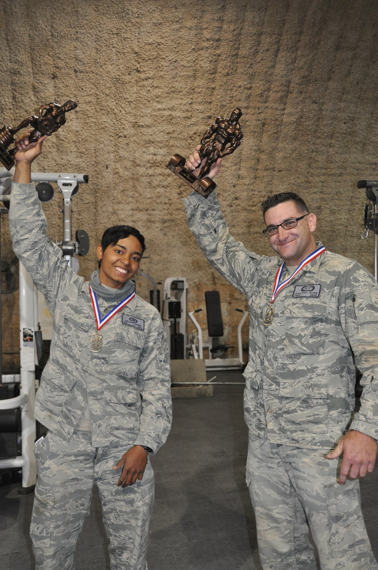 TSgt Ryan Callagy and SrA Melanie Harris, both members of 455th Expeditionary Civil Engineer Squadron, Bagram Airfield, Afghanistan, recently bested more than 40 total competitors from bases throughout the region to earn the title "strongest in the AOR." (U.S. Air Force photo/TSgt Shawn McCowan)