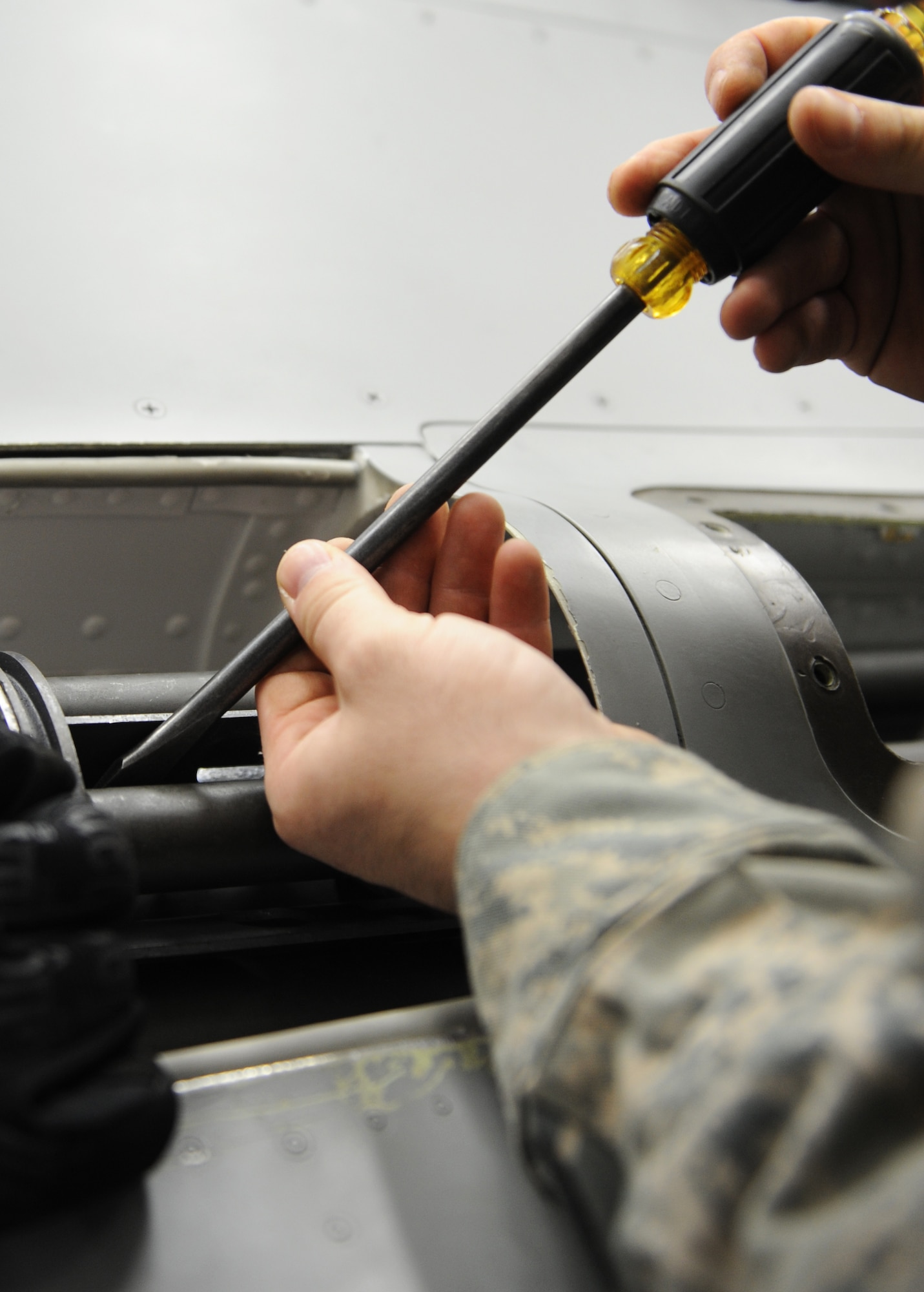 U.S. Air Force Staff Sgt. Scott Parish, 35th Aircraft Maintenance Squadron weapons team chief, removes an M61A1 Vulcan cannon from an F-16 trainer during a two-week basic flightline maintenance course at Misawa Air Base, Japan, July 2, 2012. The course consists of weapons installation and removal, troubleshooting and functional checks. (U.S. Air Force photo by Airman 1st Class Kia Atkins/Released)