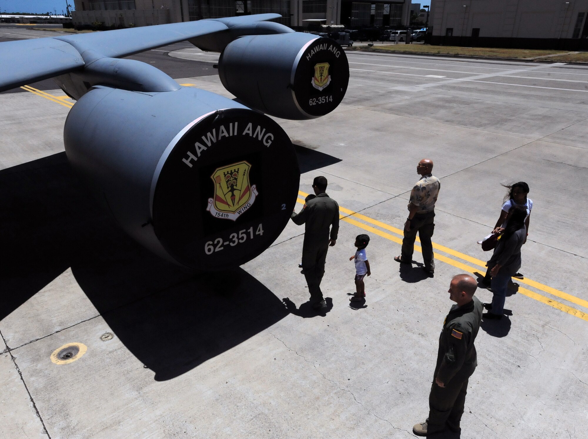 Rosco Rebibis, a patient at Kapiolani Medical battling acute lymphoblastic leukemia, and members of his family along with members of the 96th Air Refueling Squadron (in flight suits) enjoys an external tour of a KC-135 Stratotanker June 29 as part of the Pilot for a Day program at Joint Base Pearl Harbor-Hickam, Hawaii. ALL is a cancer of the blood and bone marrow and is the most common type of cancer in children. (U.S. Air Force photo by Staff Sgt. Nathan Allen)