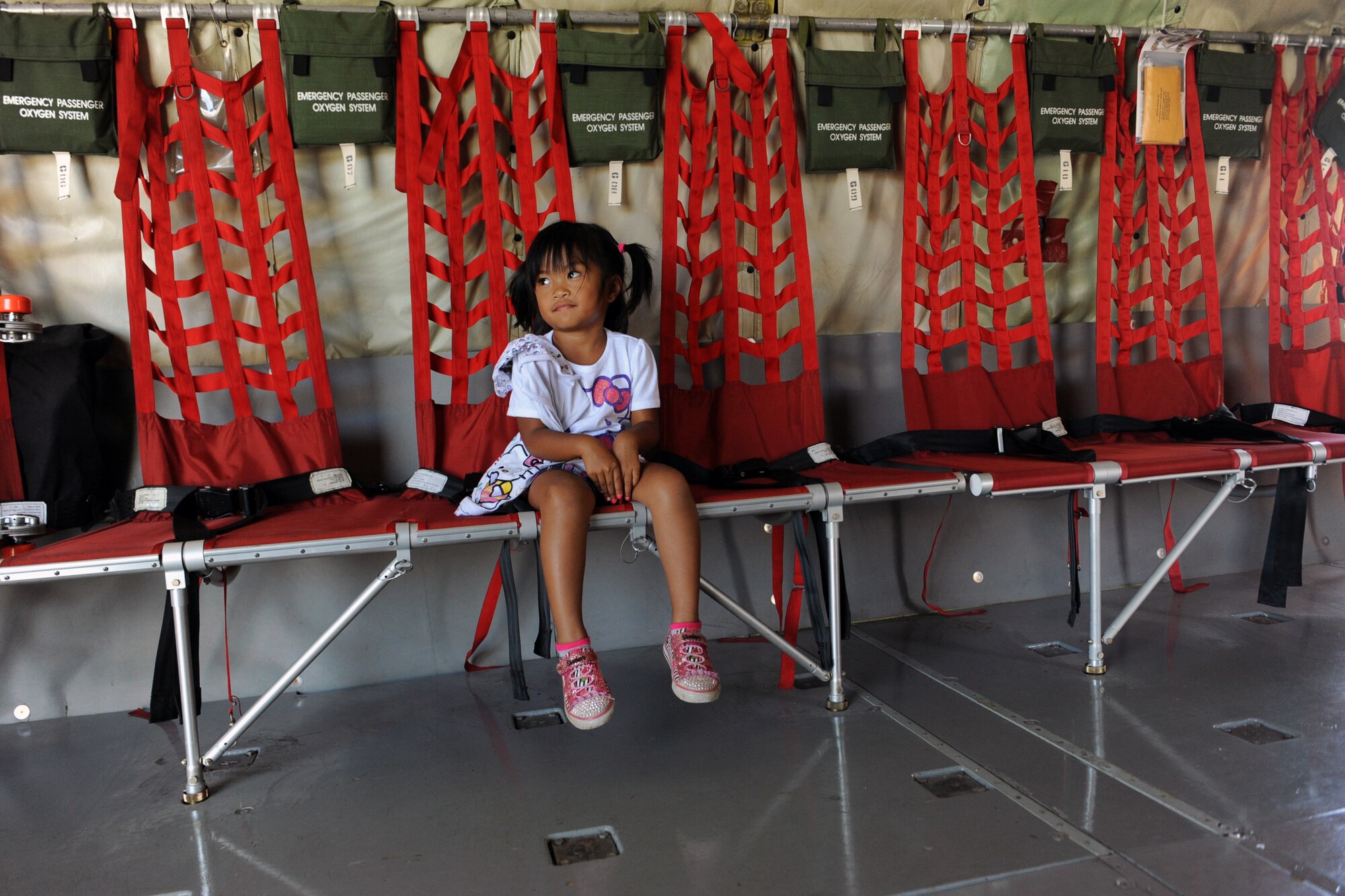 Reesa Rebibis, sister of Rosco Rebibis, a patient at Kapiolani Medical battling acute lymphoblastic leukemia, Sits in a KC-135 Stratotanker June 29 as part of the Pilot for a Day program at Joint Base Pearl Harbor-Hickam, Hawaii. ALL is a cancer of the blood and bone marrow and is the most common type of cancer in children. (U.S. Air Force photo by Staff Sgt. Nathan Allen)