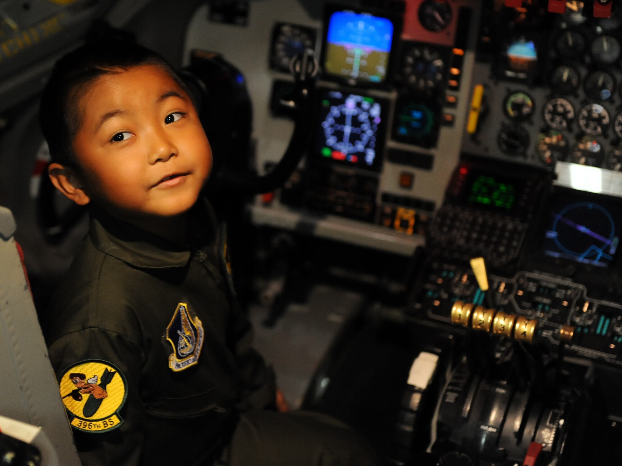 Rosco Rebibis, a patient at Kapiolani Medical battling acute lymphoblastic leukemia, sits in the pilot seat of the KC-135 aircraft simulator June 29 as part of the Pilot for a Day program at Joint Base Pearl Harbor-Hickam, Hawaii. ALL is a cancer of the blood and bone marrow and is the most common type of cancer in children. (U.S. Air Force photo by Staff Sgt. Nathan Allen)