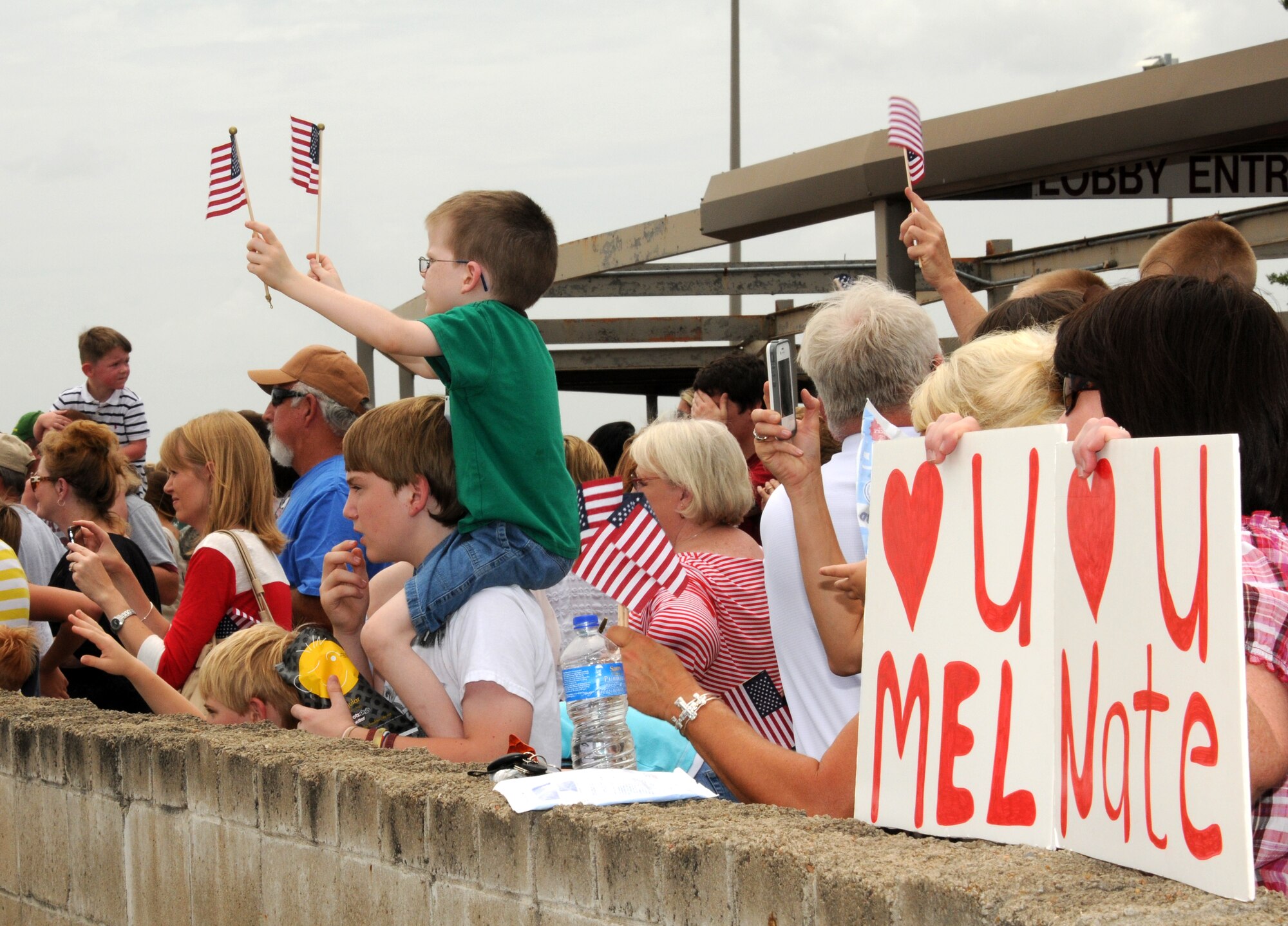 Family members of 188th Fighter Wing Airman await the departure of a McDonnell Douglas MD-11 July 2, 2012. Approximately 275 Airmen with the 188th departed Fort Smith for Afghanistan in support of Operation Enduring Freedom. (National Guard photo by Airman 1st Class John Hillier/188th Fighter Wing Public Affairs)
