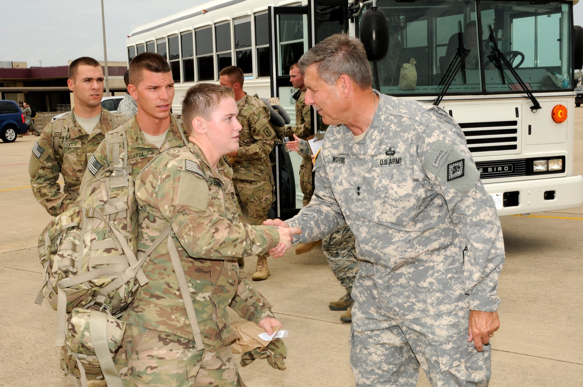 Maj. Gen. William Wofford, adjutant general for the Arkansas National Guard, shakes hands with 188th Fighter Wing Airmen prior their departure from Fort Smith, Ark., on a McDonnell Douglas MD-11 July 2, 2012. Approximately 275 Airmen with the 188th departed Fort Smith for Afghanistan in support of Operation Enduring Freedom. (National Guard photo by Senior Master Sgt. Dennis Brambl/188th Fighter Wing Public Affairs)