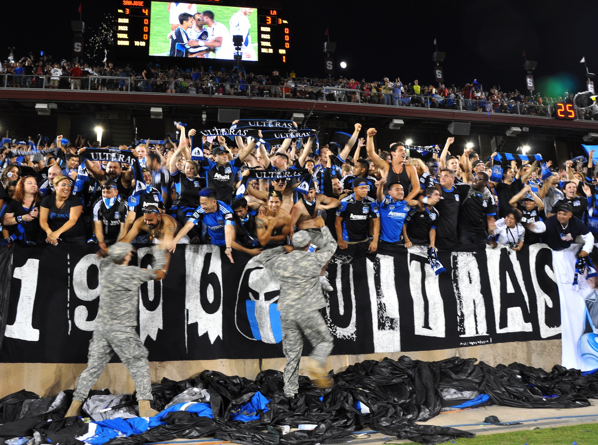 U.S. servicemembers celebrate with San Jose Earthquakes fans after the team’s 4-3 win over the L.A. Galaxy at Stanford Stadium, Stanford, Calif., June 30, 2012. The military appreciation game featured a halftime marching performance from every service. (U.S. Air Force photo by Staff Sgt. Robert M. Trujillo/Released)