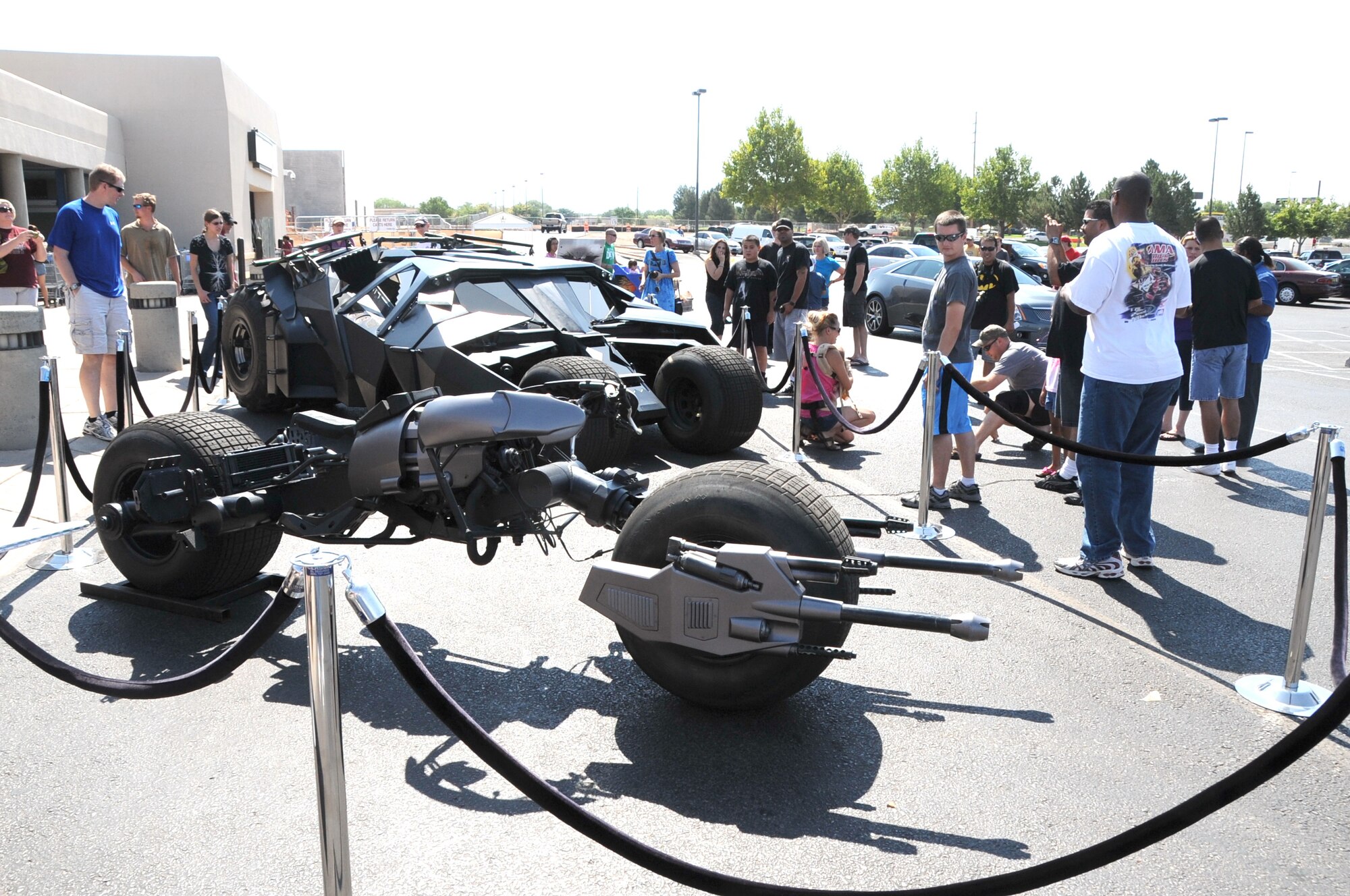 KIRTLAND AFB, N.M. -- The “Tumbler” and “Bat-Pod” stopped Sunday, July 1, at the Kirtland AFB commissary as part of a national tour by the vehicles from the upcoming Batman movie, “The Dark Knight Rises.”  (Photo by Dennis Carlson)
