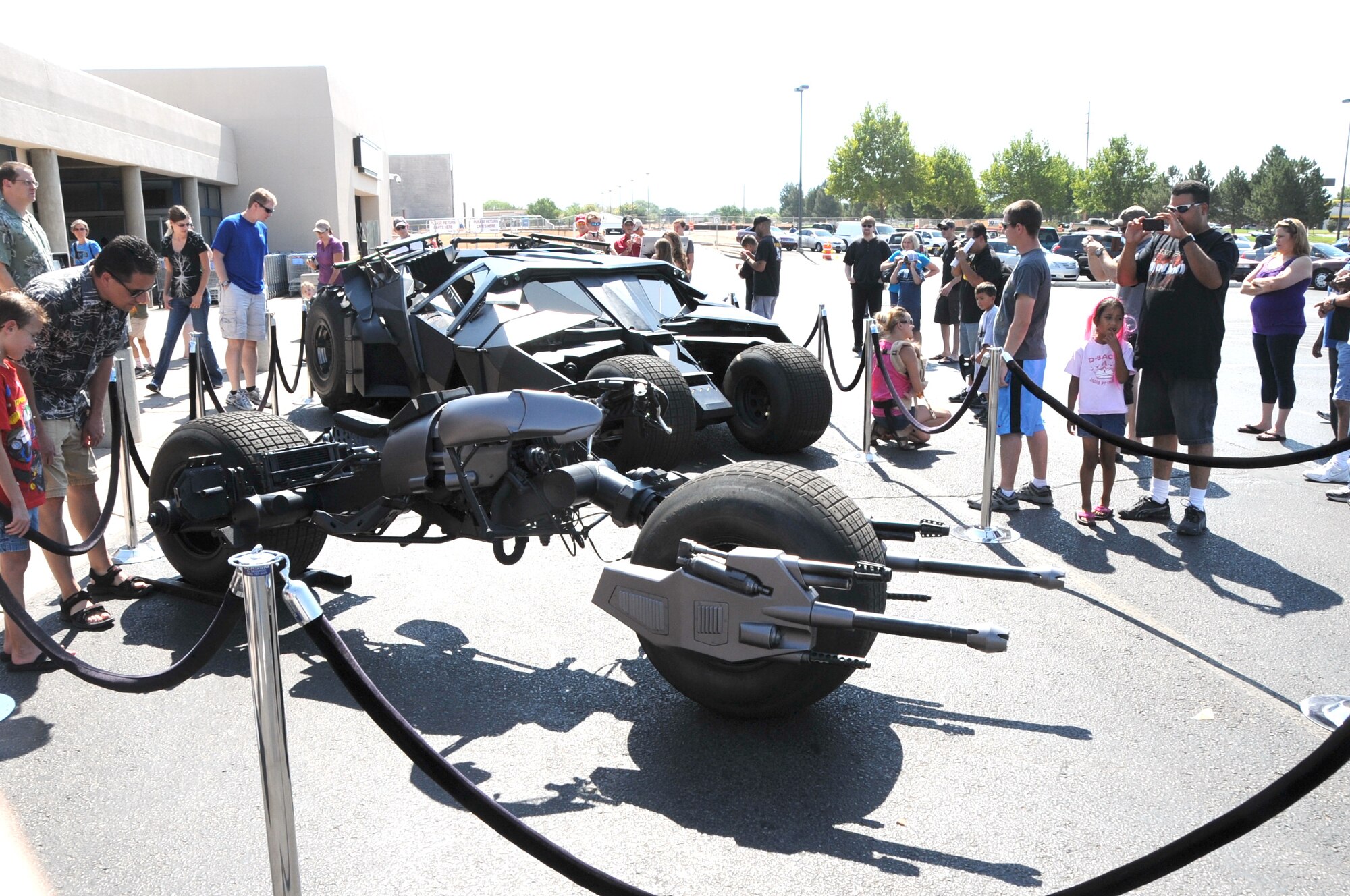 KIRTLAND AFB, N.M. -- The “Tumbler” and “Bat-Pod” stopped Sunday, July 1, at the Kirtland AFB commissary as part of a national tour by the vehicles from the upcoming Batman movie, “The Dark Knight Rises.”  (Photo by Dennis Carlson)
