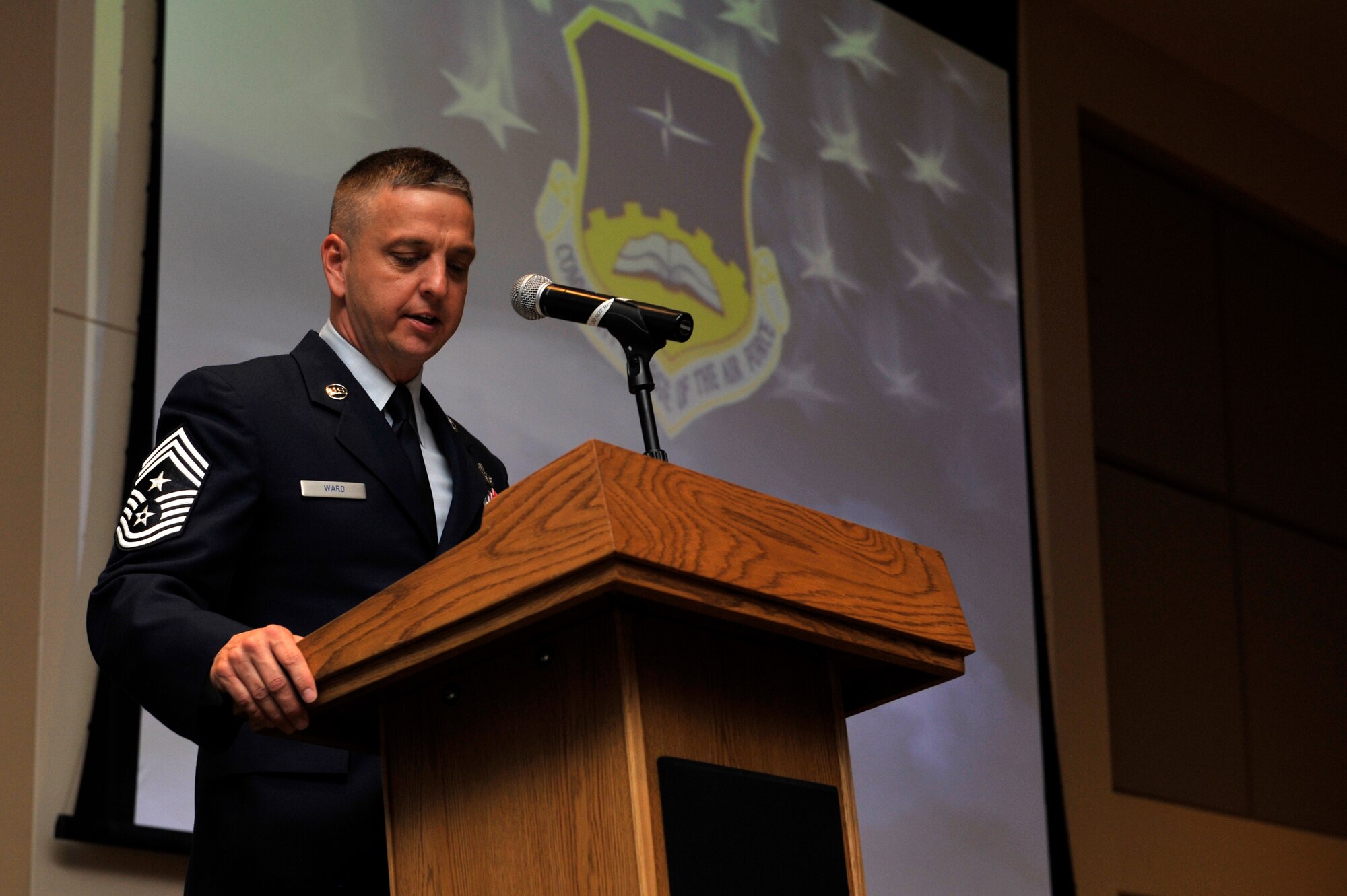 BUCKLEY AIR FORCE BASE, Colo. – Community College of the Air Force graduation guest speaker Chief Master Sgt. William Ward, 460th Space Wing command chief, addresses graduates June 29, 2012.  Ward spoke on the importance of the CCAF degree and education among the enlisted corps.  (U.S. Air Force photo by Airman 1st Class Riley Johnson)