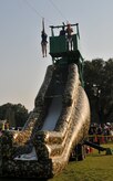 Master Sgt. Jason Miller, 373rd Training Squadron Command Support Staff non-commissioned officer in charge and his daughter, Ana, descend a zip-line June 29, during the 2012 Freedom Fest at Marrington Plantation at Joint Base Charleston – Weapons Station. Nearly 1,500 Sailors, Airmen, civilians and their families attended the fest which included food, drinks, festival rides, music and fireworks. (U.S. Air Force photo/Airman 1st Class Jared Trimarchi)