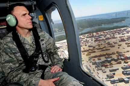 Brig. Gen. Timothy Green, Director of Installations and Mission Support, Headquarters Air Mobility Command, Scott Air Force Base, Ill., looks out the window of a UH-60 Black Hawk while flying over Charleston, S.C., June 27, 2012.  Green and Maj. Gen. Timothy Byers, the Civil Engineer, Headquarters Air Force, Washington D.C., were given an aerial tour of Joint Base Charleston - Air Base and Weapons Station, Short Stay Naval recreation area and North Auxiliary Air Field.  Byers and Green were accompanied by members of JB Charleston leadership.  (U.S. Air Force/Staff Sgt. Nicole Mickle)  