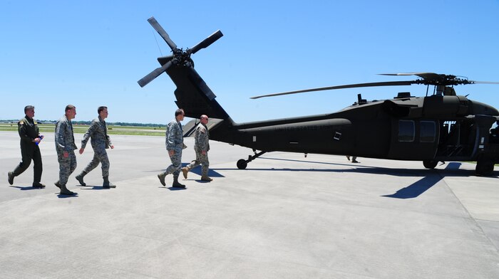 Army 1st Lt. Josh Puette, UH-60 Black Hawk pilot, 1st Battalion, 151st Aviation Regiment, 59th Aviation Troop Command, Columbia, S.C., escorts Maj. Gen. Timothy Byers, the Civil Engineer, Headquarters Air Force, Washington D.C., Brig. Gen. Timothy Green, Director of Installations and Mission Support, Headquarters Air Mobility Command, Scott Air Force Base, Ill., Col. Richard McComb, Joint Base Charleston commander and Col. Al Miller, 437th Airlift Wing vice commander, to the Black Hawk at the Atlantic Aviation flight-line, North Charleston, S.C., June 27, 2012.  Byers and Green were given an aerial tour of Joint Base Charleston - Air Base and Weapons Station, Short Stay Naval recreation area and North Auxiliary Air Field.  Byers and Green were accompanied by members of JB Charleston leadership.  (U.S. Air Force/Staff Sgt. Nicole Mickle)  