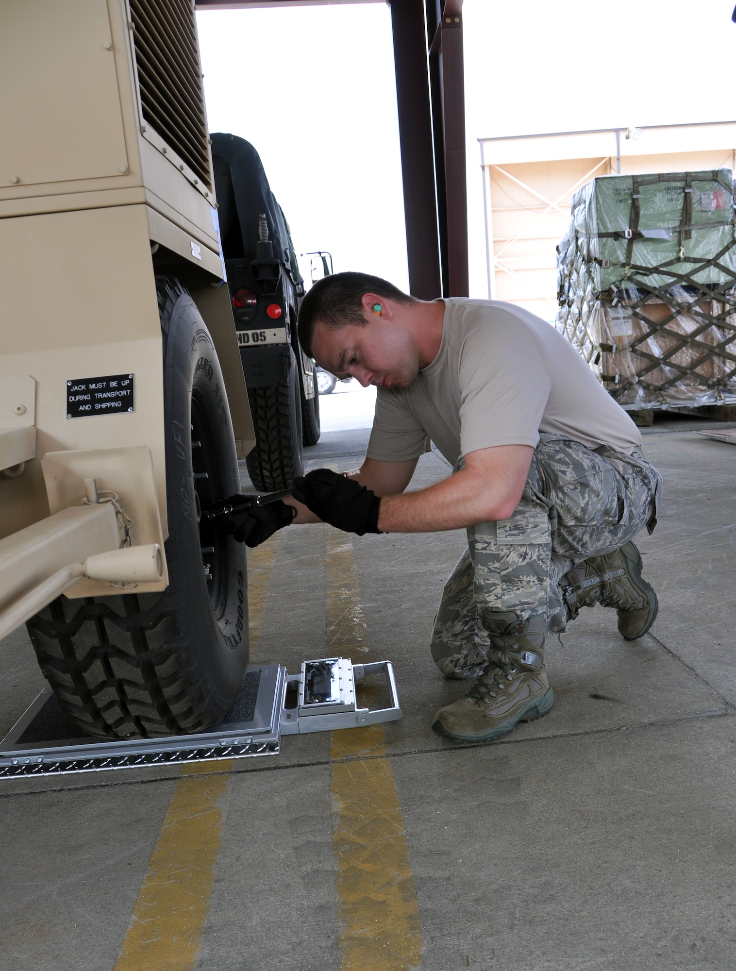 Tech. Sgt. Mitchell Brown, of the 80th Aerial Port Squadron, checks tire pressure of potential cargo, during a cargo inspection challenge at this year’s Port Dawg Challenge June 20 at Dobbins ARB. Teams competed in various challenges to showcase their capabilities as aerial porters. (U.S. Air Force photo/Senior Airman Elizabeth Gaston)