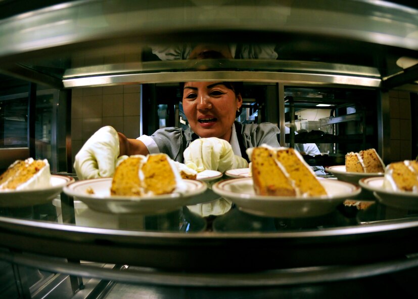 Kyong Lebel, a civilian with 919th Force Support Squadron, sets out the desserts for the lunch meal inside the dining facility at Duke Field, Fla. The civilian staff plays a key role in the monthly support of the dining facility and helped the unit win its seventh Hennessy Trophy since 2000. The Hennessy Trophy is an annual award presented to Air Force installations with the best food-service programs. (U.S. Air Force photo/Tech. Sgt. Cheryl Foster)
