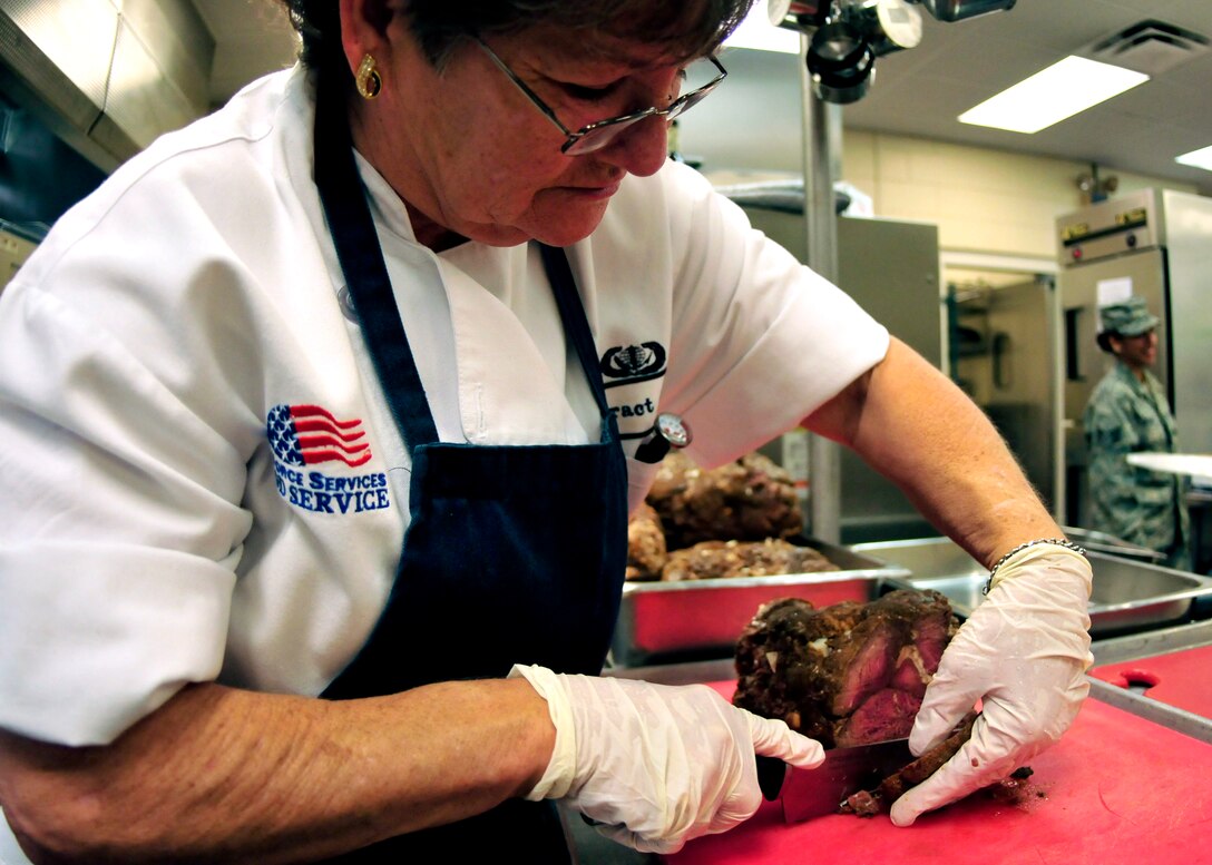 Brenda Smith, a civilian cook with the 919th Force Support Squadron, slices roast beef for the lunch meal at the dining facility on Duke Field, Fla. The civilian staff plays a key role in the monthly support of the dining facility and helped the unit win its seventh Hennessy Trophy since 2000. The Hennessy Trophy is an annual award presented to Air Force installations with the best food-service programs. (U.S. Air Force photo/Tech. Sgt. Cheryl Foster)