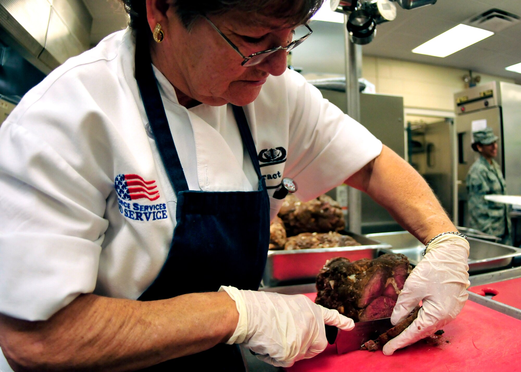 Brenda Smith, a civilian cook with the 919th Force Support Squadron, slices roast beef for the lunch meal at the dining facility on Duke Field, Fla. The civilian staff plays a key role in the monthly support of the dining facility and helped the unit win its seventh Hennessy Trophy since 2000. The Hennessy Trophy is an annual award presented to Air Force installations with the best food-service programs. (U.S. Air Force photo/Tech. Sgt. Cheryl Foster)