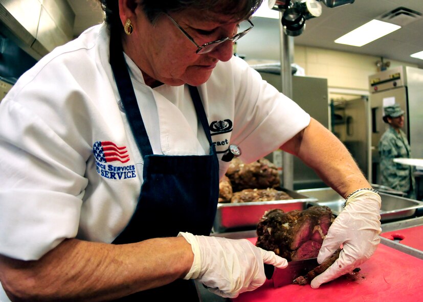 Brenda Smith, a civilian cook with the 919th Force Support Squadron, slices roast beef for the lunch meal at the dining facility on Duke Field, Fla. The civilian staff plays a key role in the monthly support of the dining facility and helped the unit win its seventh Hennessy Trophy since 2000. The Hennessy Trophy is an annual award presented to Air Force installations with the best food-service programs. (U.S. Air Force photo/Tech. Sgt. Cheryl Foster)