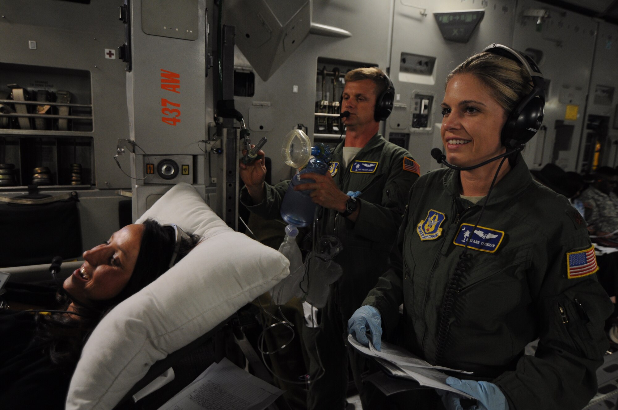 Maj. Roseann Teckman and Tech. Sgt. Gregory Gaines complete a training scenario with Sherry Perkins who plays the role of a patient onboard a C-17 Globemaster III aircraft during a training flight to Keesler Air Force Base, Miss. June 21, 2012. The flight introduced Perkins, and other Guard and Reserve employers, to the U.S. Air Force Reserve and allowed them to see what their employees do when they report for training and participate in real-world missions. Teckman is a 315 AES flight nurse, Gaines is a 315 AES aeromedical evacuation technician, and Perkins is a clinical manager at one of the Roper St. Francis Healthcare emergency departments in Charleston, S.C. (U.S. Air Force Photo/Staff Sgt. Shane Ellis)