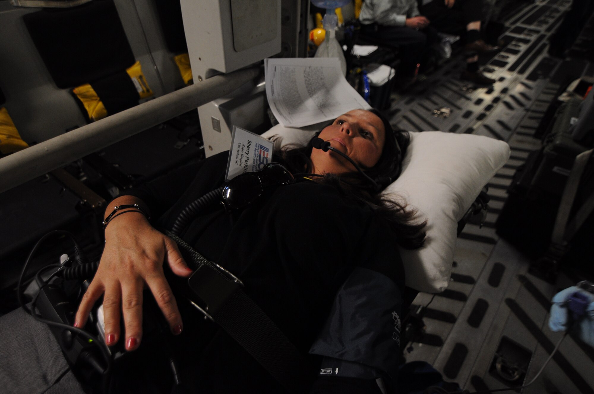 Sherry Perkins is strapped to a litter while she plays the role of a patient onboard a C-17 Globemaster III aircraft during a 315th Aeromedical Evacuation Squadron training flight to Keesler Air Force Base, Miss. June 21, 2012. The flight introduced Perkins, and other Guard and Reserve employers, to the U.S. Air Force Reserve and allowed them to see what their employees do when they report for training and participate in real-world missions. Perkins is a clinical manager at one of the Roper St. Francis Healthcare emergency departments in Charleston, S.C. (U.S. Air Force Photo/Staff Sgt. Shane Ellis)