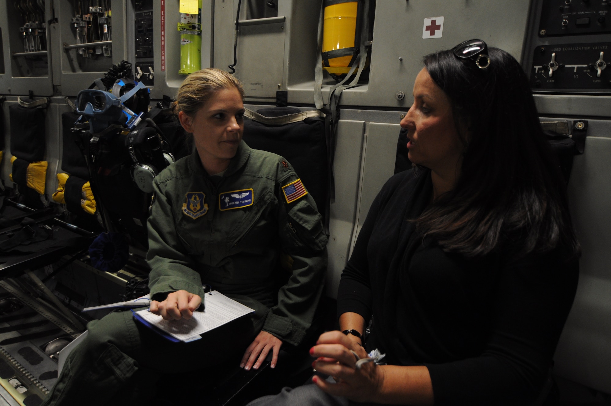 Maj. Roseann Teckman and Sherry Perkins talk about life as a flight nurse during a 315th Aeromedical Evacuation Squadron training flight to Keesler Air Force Base, Miss. June 21, 2012. The flight introduced Guard and Reserve employers to the U.S. Air Force Reserve and allowed them to see what their employees do when they report for training and participate in real-world missions.  Teckman is a flight nurse with the 315 AES and an automated external defibrillator coordinator at Roper St. Francis Healthcare in Charleston, S.C. Perkins is a clinical manager at one of the Roper St. Francis Healthcare emergency departments in Charleston, S.C. (U.S. Air Force Photo/Staff Sgt. Shane Ellis)