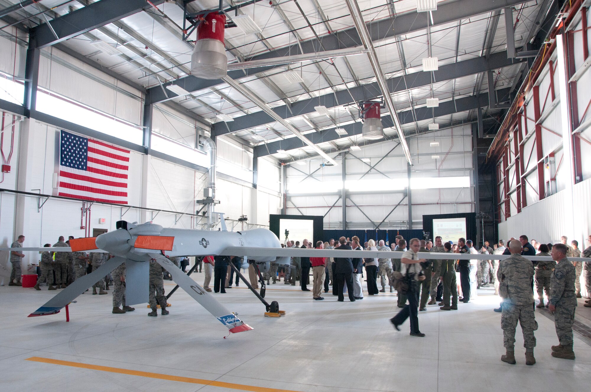 The 163rd Reconaissance Wing celebrates, officially opening its new Formal Training Unit hangar (FTU) with a ribbon cutting ceremony at Southern California Logistics Airport in Victorville, June 15, 2012.  The new hangar  is 17,500 Sq. ft. and will support the 163rd Reconnaissance Wing's Formal Training Unit (FTU), which trains the Air Force's remotely piloted aircraft crews. Predators can be launched from the hangar and controls transferred over satellite to student pilots at March Air Reserve Base.(Air National Guard Photo/ Master Sgt. Julie Avey)
