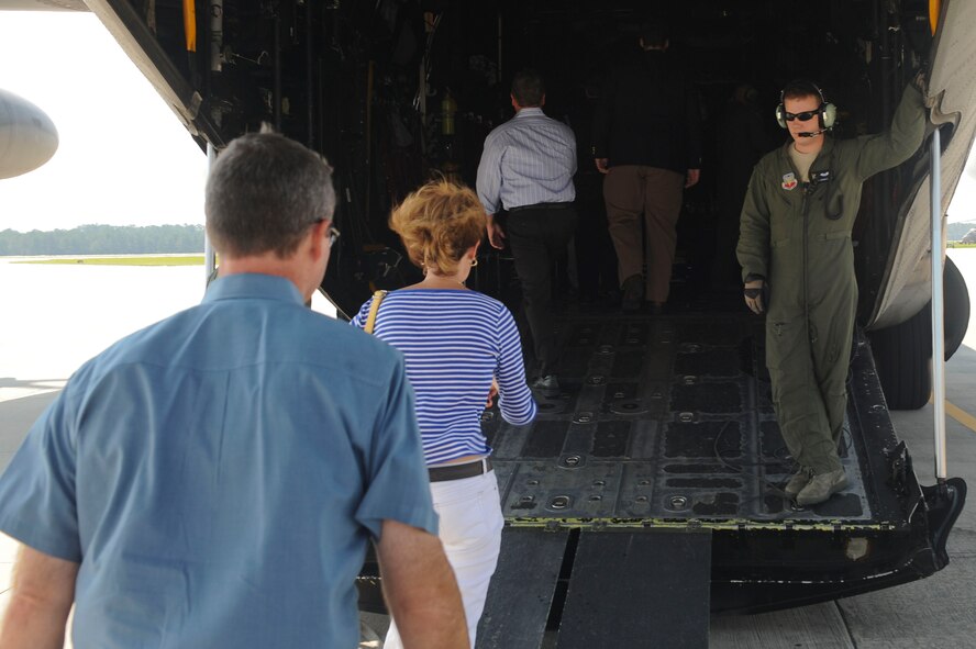 Mood honorary commanders board an HC-130P Combat King at Moody Air Force Base, Ga., June 29, 2012. The honorary commanders visited as part of immersion day, took part in a base tour, received a mission briefing and attended a promotion ceremony. (U.S. Air Force photo by Staff Sgt. Ciara Wymbs/Released)  