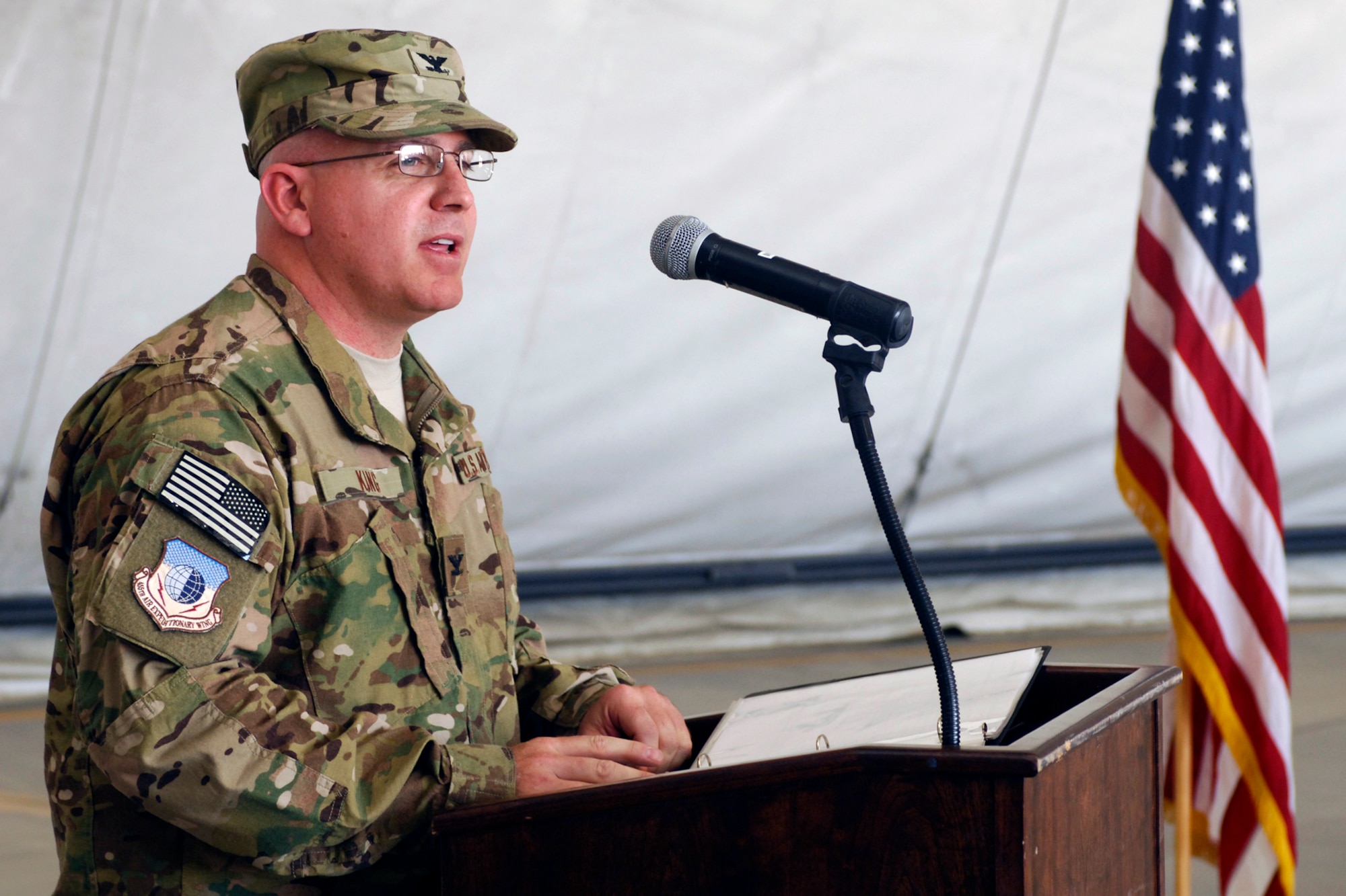 Col. Jeffrey King, 455th Expeditionary Maintenance Group commander, address the 455 EMXG after assuming command of the group at Bagram Airfield, Afghanistan, July 2, 2012. Colonel King is a career maintenance officer and has deployed in support of Operations Southern Watch, Northern Watch, Iraqi Freedom and Enduring Freedom. (U.S. Air Force photo/Staff Sgt. Jeff Nevison)