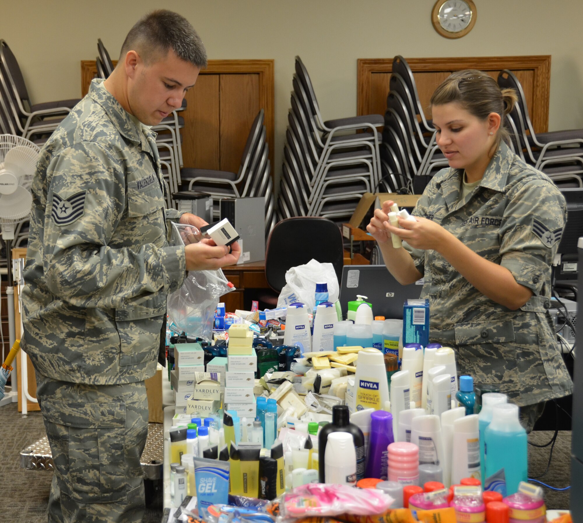 WRIGHT-PATTERSON AIR FORCE BASE, Ohio – 445th Airlift Wing Airman’s Council members Tech. Sgt. Joseph Valenzuela, 445th Aeromedical Evacuation Squadron aircrew aeromedical medical services and Senior Airman Laura Wagner, 445th Operations Support Squadron information specialist, build comfort kits for Dayton Veterans Affairs Medical Center residents May 31. The Airman’s Council built and delivered 180 comfort kits for the residents with each kit containing 20 toiletry items. (U.S. Air Force photo/Stacy Vaughn)