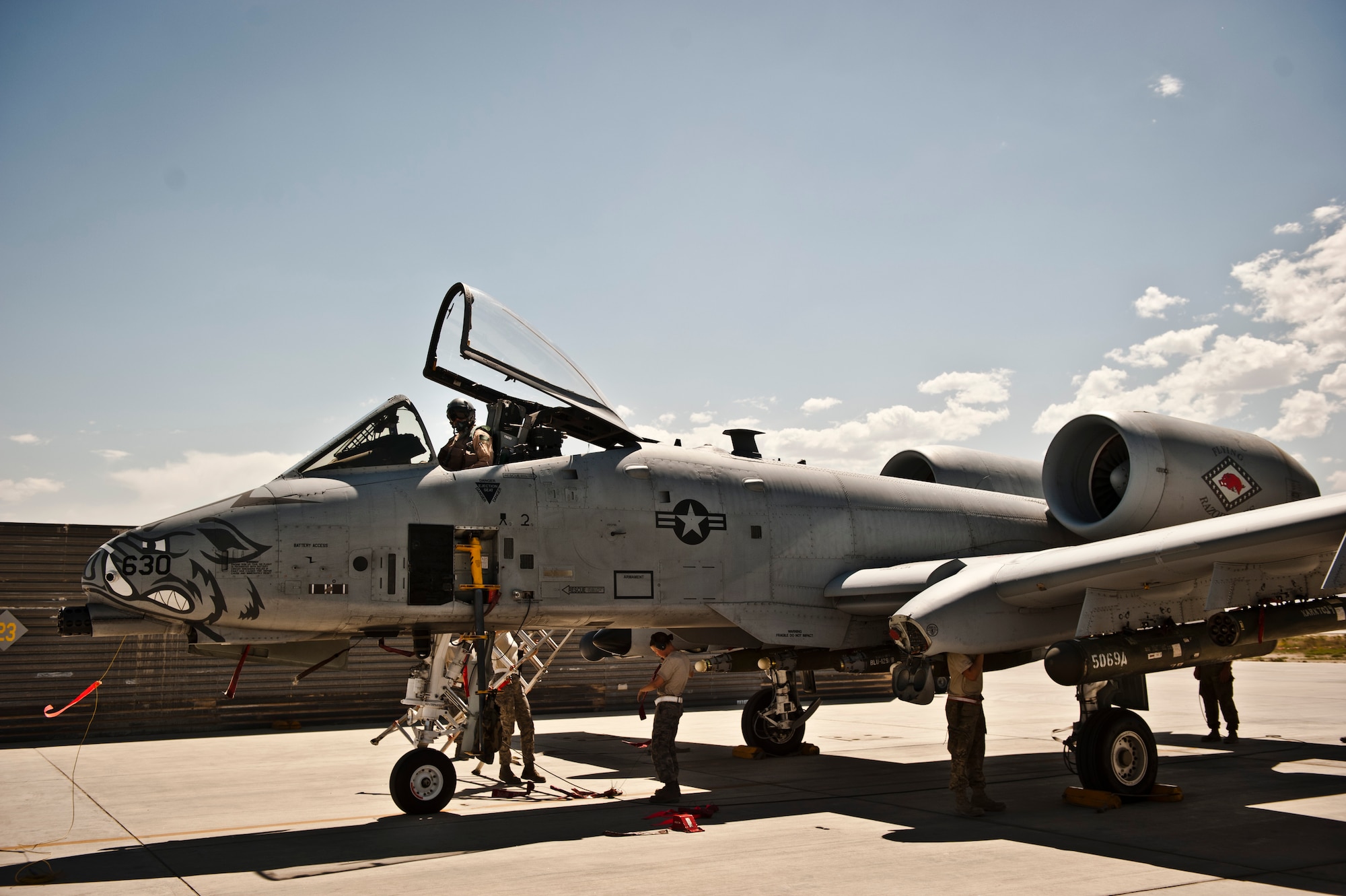 Airmen from the 455th Air Expeditionary Wing receive a A-10 Thunderbolt II after a mission at Bagram Airfield, Afghanistan, June 30, 2012. The 455th AEW is responsible for providing responsive and precise close-air support to NATO and Afghan ground forces operating in Afghanistan. (U.S. Air Force photo/Capt. Raymond Geoffroy)