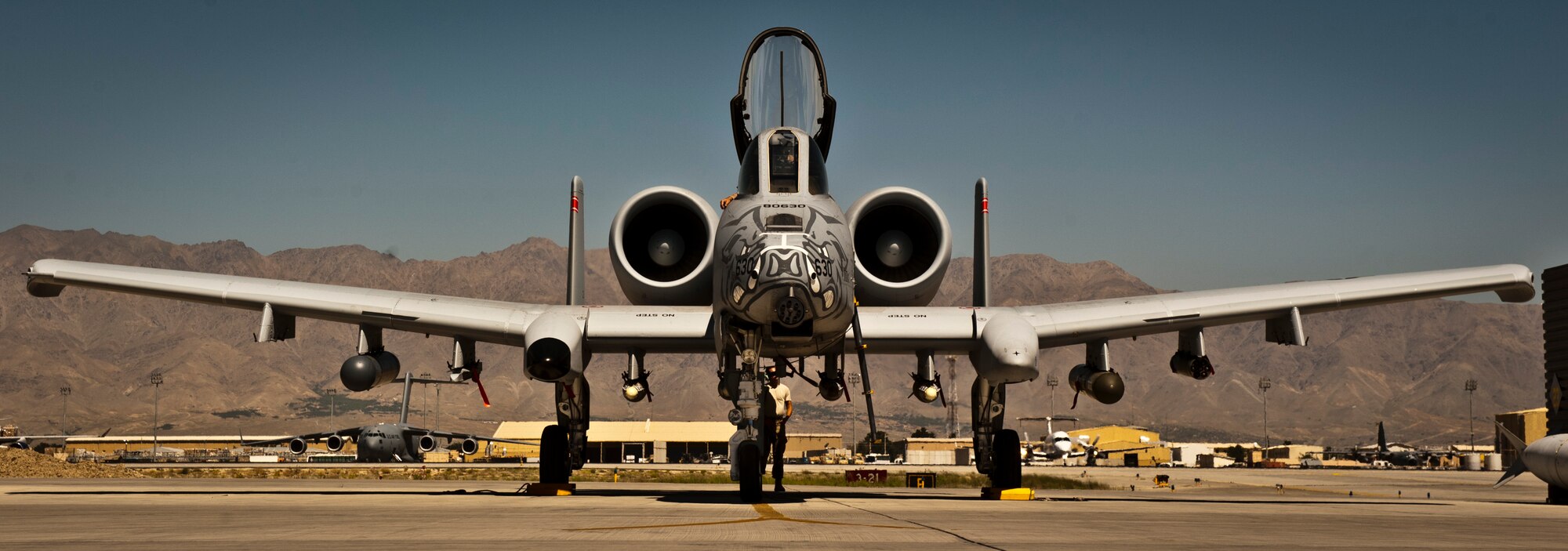 Airmen from the 455th Air Expeditionary Wing prepare a U.S. Air Force A-10 Thunderbolt II for a mission at Bagram Airfield, Afghanistan, June 30, 2012. The 455th AEW is responsible for providing responsive and precise close-air support to NATO and Afghan ground forces operating in Afghanistan. (U.S. Air Force photo/Capt. Raymond Geoffroy)