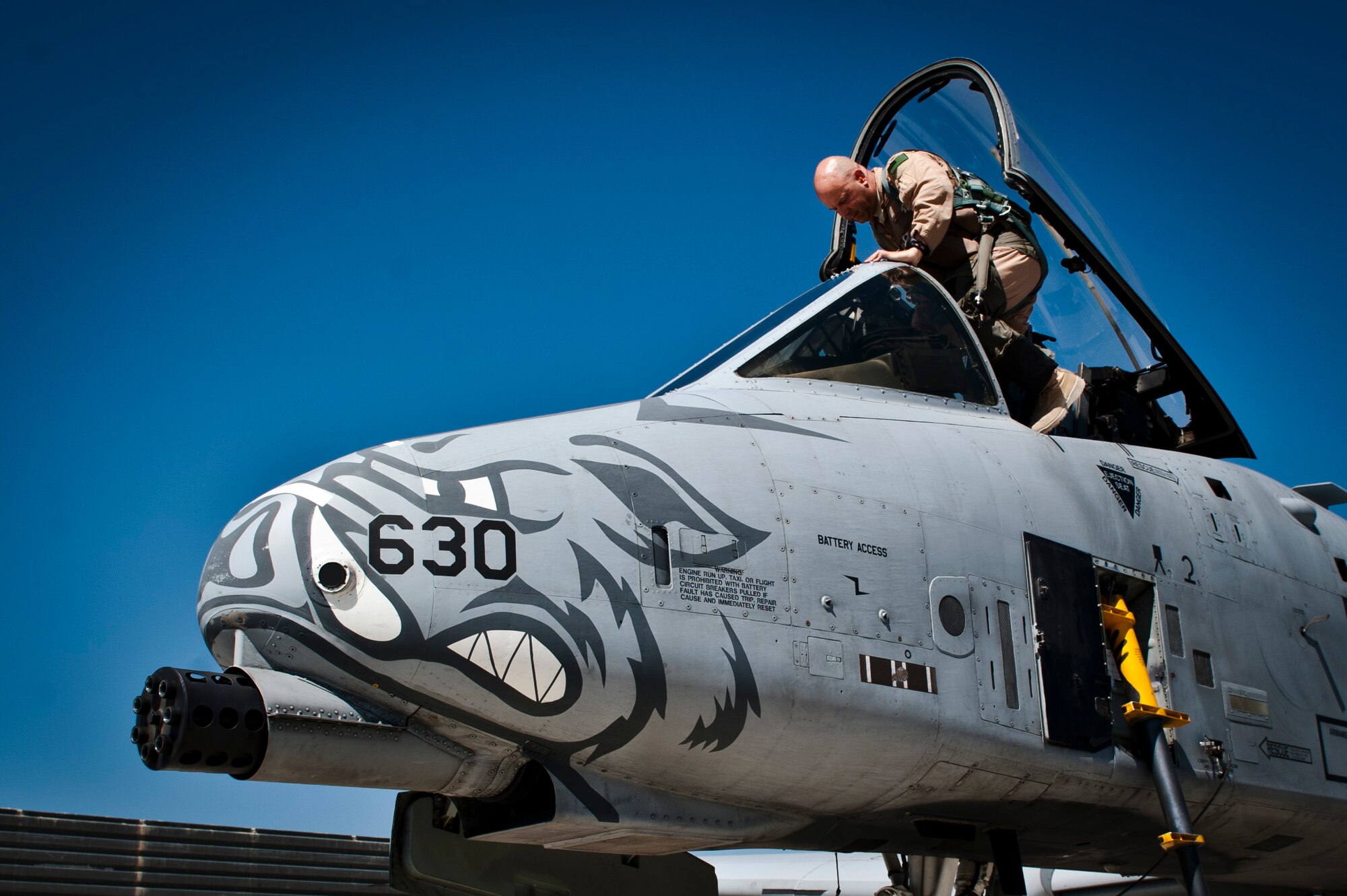 A pilot assigned to the 104th Expeditionary Fighter Squadron enters the cockpit of a U.S. Air Force A-10 Thunderbolt II for a mission at Bagram Airfield, Afghanistan, June 30, 2012. Affectionately called the ‘Warthog’, the A-10 is a specialized ground-attack aircraft which provides close-air support to ground forces operating in Afghanistan. (U.S. Air Force photo/Capt. Raymond Geoffroy)