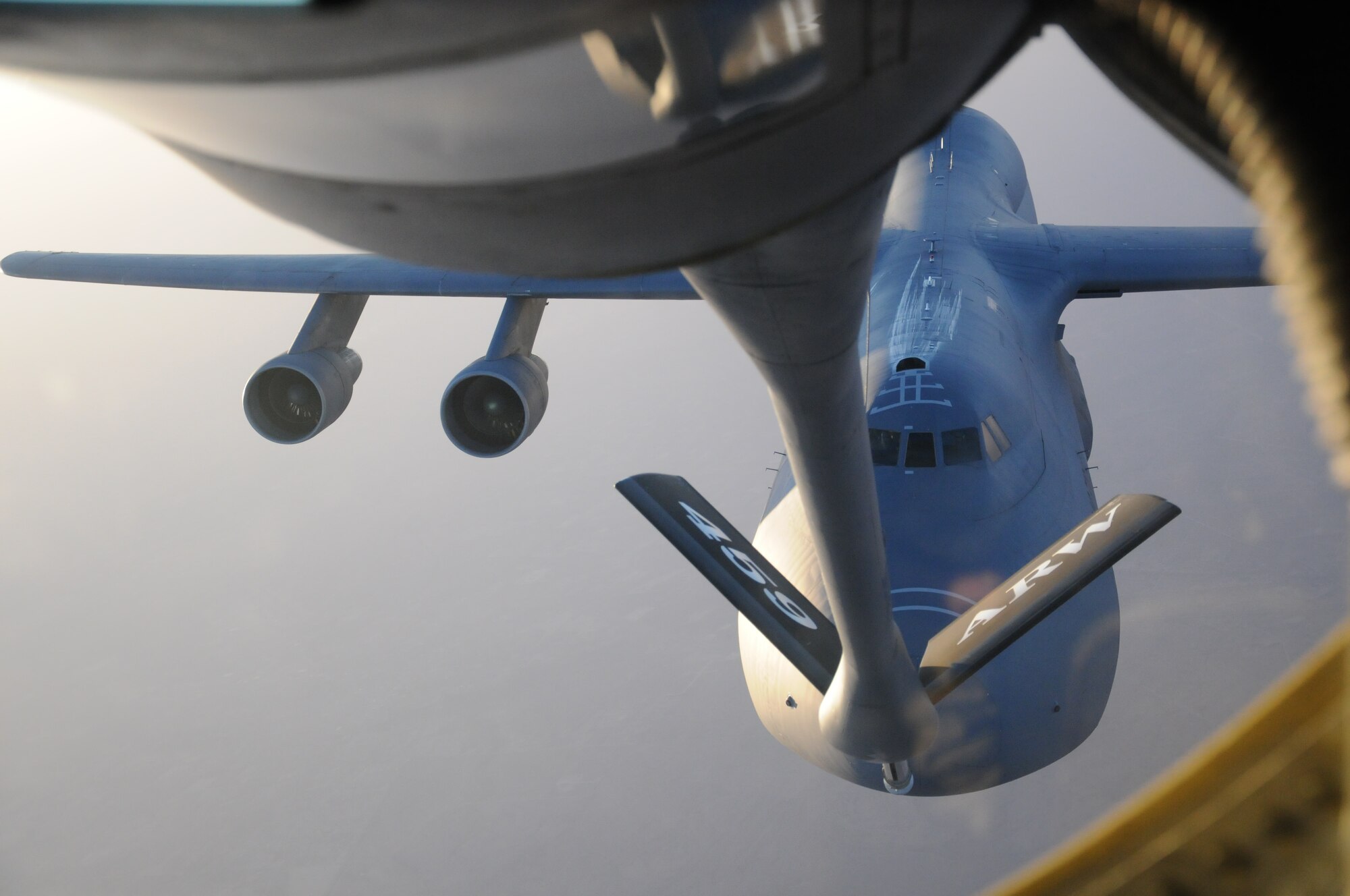 A Lockheed C-5 Galaxy aircraft of the 356th Airlift Squadron here, approaches the back of a KC-135 Stratotanker from the 459th Air Refueling Wing of Joint Base Andrews, Md., June 28. The KC-135 crew is assisting the 356th AS for a business effort where new C-5 pilots get qualified on aerial refueling. (U.S. Air Force photo/Senior Airman Katie Spencer)
