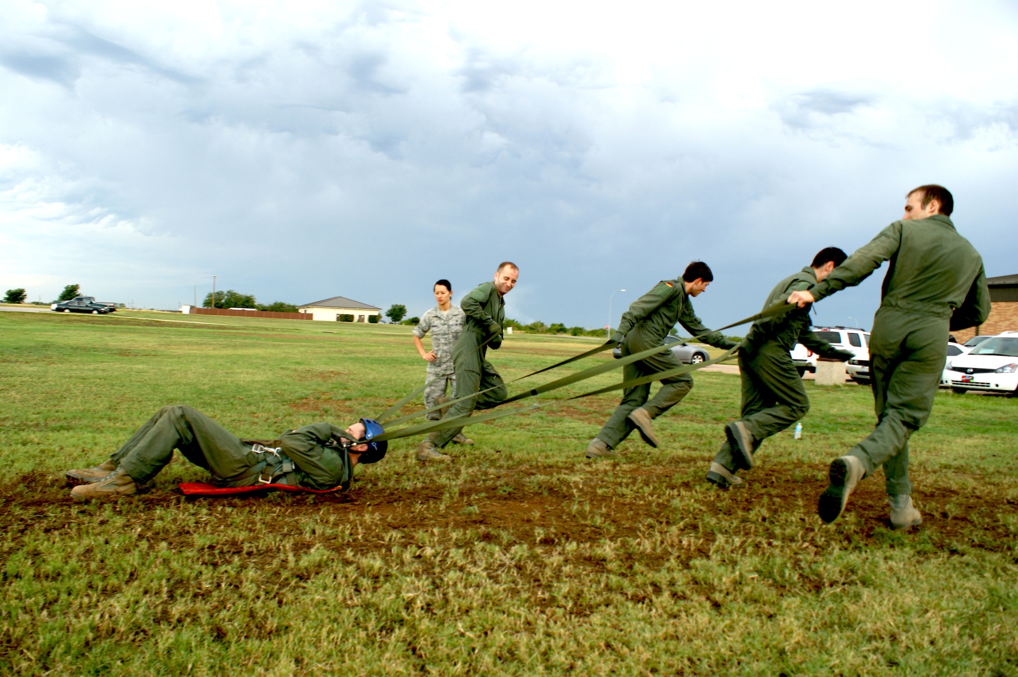 Students in the Euro-NATO Joint Jet Pilot training program practice releasing themselves from a mock parachute canopy during training at Sheppard Air Force Base, Texas on Jun 15, 2012.  Understanding parachute techniques is part of the physiology training curriculum taught to first-year pilots. (U.S. Air Force photo/Dan Hawkins)