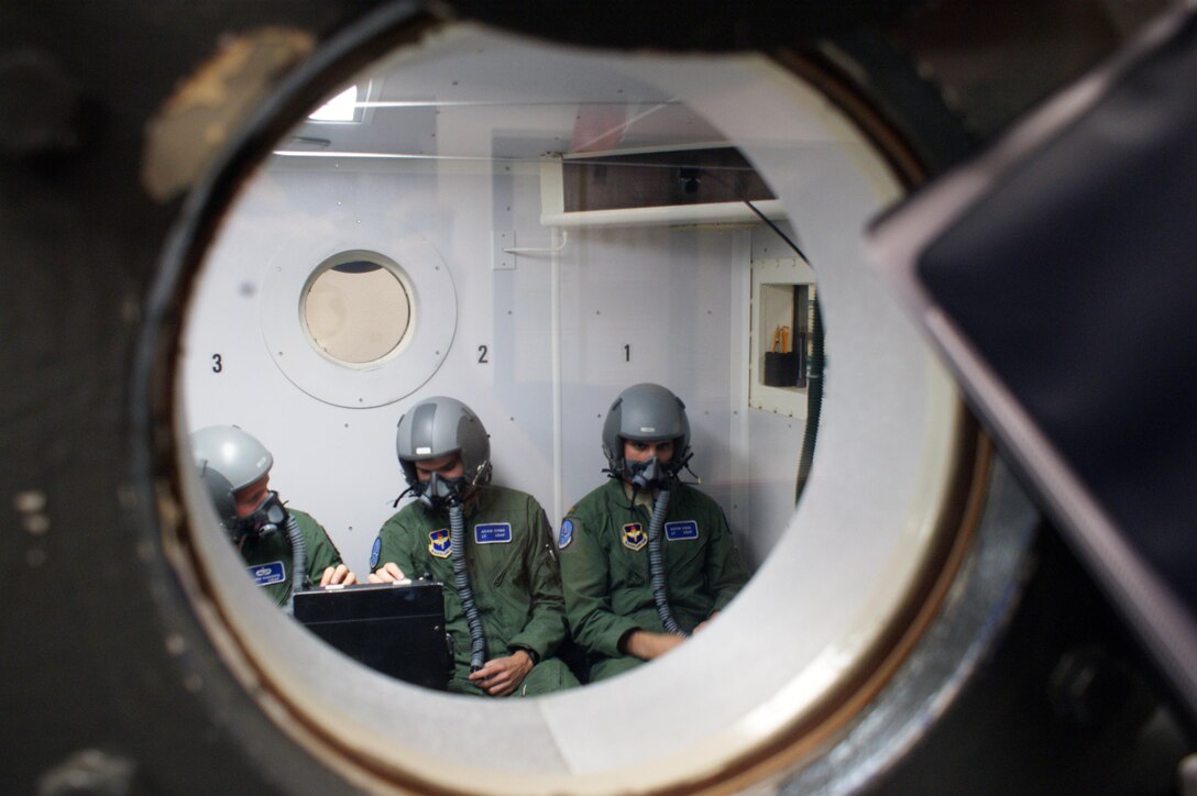 Undergraduate pilot training students in the Euro-NATO Joint Jet Pilot Training program take part in an altitude chamber flight at Sheppard Air Force Base Jun 8, 2012.  Altitude training to recognize the symptoms of hypoxia, a lack of oxygen to the blood and brain, is a critical part of ensuring pilots and aircrew are ready to endure the stressors with altitude-induced human factors.  (U.S. Air Force photo/Dan Hawkins)