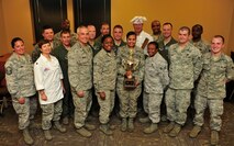 MINOT AIR FORCE BASE, N.D. -- The 91st Missile Wing celebrates their victory with “Warrior Chef 2012” winners, Staff Sgt. Ashley Sakurai, Senior Airman Antona Gaskins, both from the 741st Missile Squadron and SrA Qushondra Owens, 721 Missile Squadron, here June 27. The annual competition gave Team Minot chefs the chance to demonstrate their skills and be recognized for their talents in a friendly environment. It was a true test of culinary mastery as a team from each wing went head-to-head in a 45-minute, ultimate dish showdown. (U.S. Air Force photo/Senior Airman Desiree W. Esposito)
