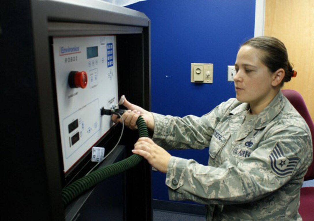 Tech. Sgt. Jennifer Flecker, NCOIC of Aerospace and Operational Physiology with the 7th Aerospace Medicine Squadron, performs shut-down procedures for the Reduced Oxygen Breathing Device (ROBD) at Dyess Air Force Base, Texas, Jun. 5, 2012.  The ROBD is used to conduct physiology refresher training for pilots of  ejection seat aircraft, allowing them to experience oxygen deprivation while in a flight simulator. (U.S. Air Force photo/Dan Hawkins)