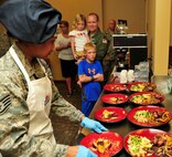 MINOT AIR FORCE BASE, N.D. -- Staff Sgt. Ashley Sakurai, 741st Missile Squadron missile chef, inspects completed dishes before her teams presentation to the judges during the “Warrior Chef 2012” competition, here June 27. The annual competition gave Team Minot chefs the chance to demonstrate their skills and be recognized for their talents in a friendly environment. It was a true test of culinary mastery as a team from each wing went head-to-head in a 45-minute, ultimate dish showdown. (U.S. Air Force photo/Senior Airman Desiree W. Esposito)