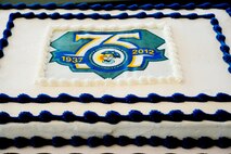 A 75th anniversary cake is presented during a dining-out celebrating the birthday of the 3d Weather Squadron at the Killeen Civic Center, Killen, Texas, June 25, 2012. The cake is designed after the commemorative coin marking the squadron’s 75 years of activity. (U.S. Air Force photo by Staff Sgt. Joshua J. Garcia/Released)