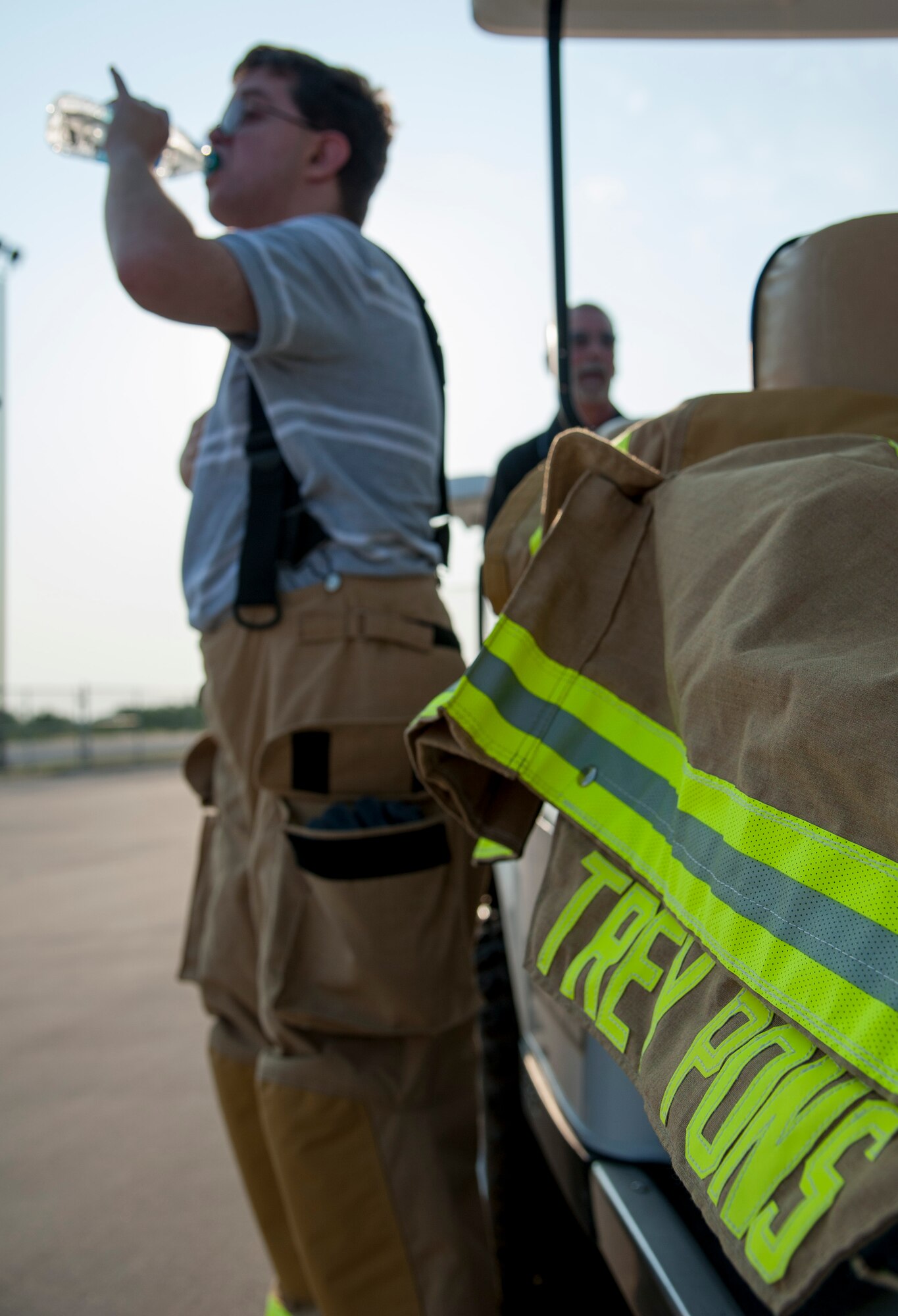 GOODFELLOW AIR FORCE BASE, Texas-- Maxwell “Trey” Pons III, Honorary Air Force firefighter, quenches his thirst after finishing training block one at the Louis F. Garland DOD Fire Academy June 28. Pons, who is autistic, sight impaired and hearing-impaired, had his childhood dream come true after a day filled with learning at the Fire Academy. (U.S. Air Force photo/Airman 1st Class Michael Smith)